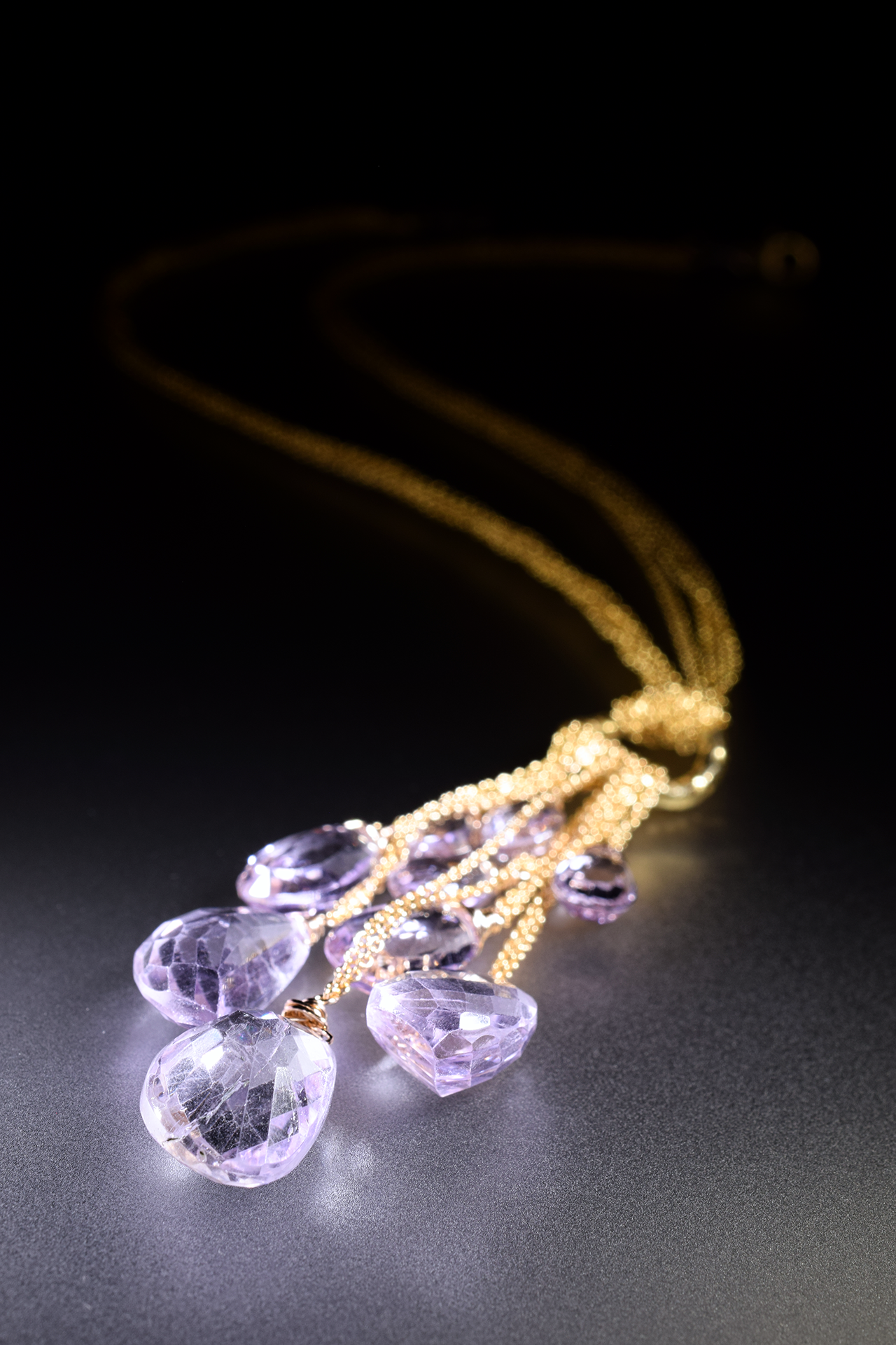 details of a pink amethyst multi drop gold chain necklace