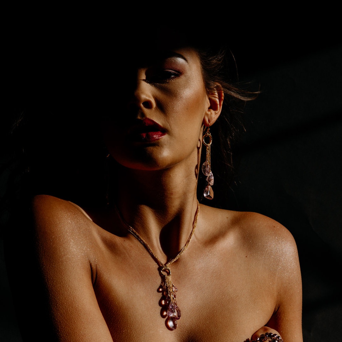 model wearing a pink amethyst multi drop and gold chain necklace