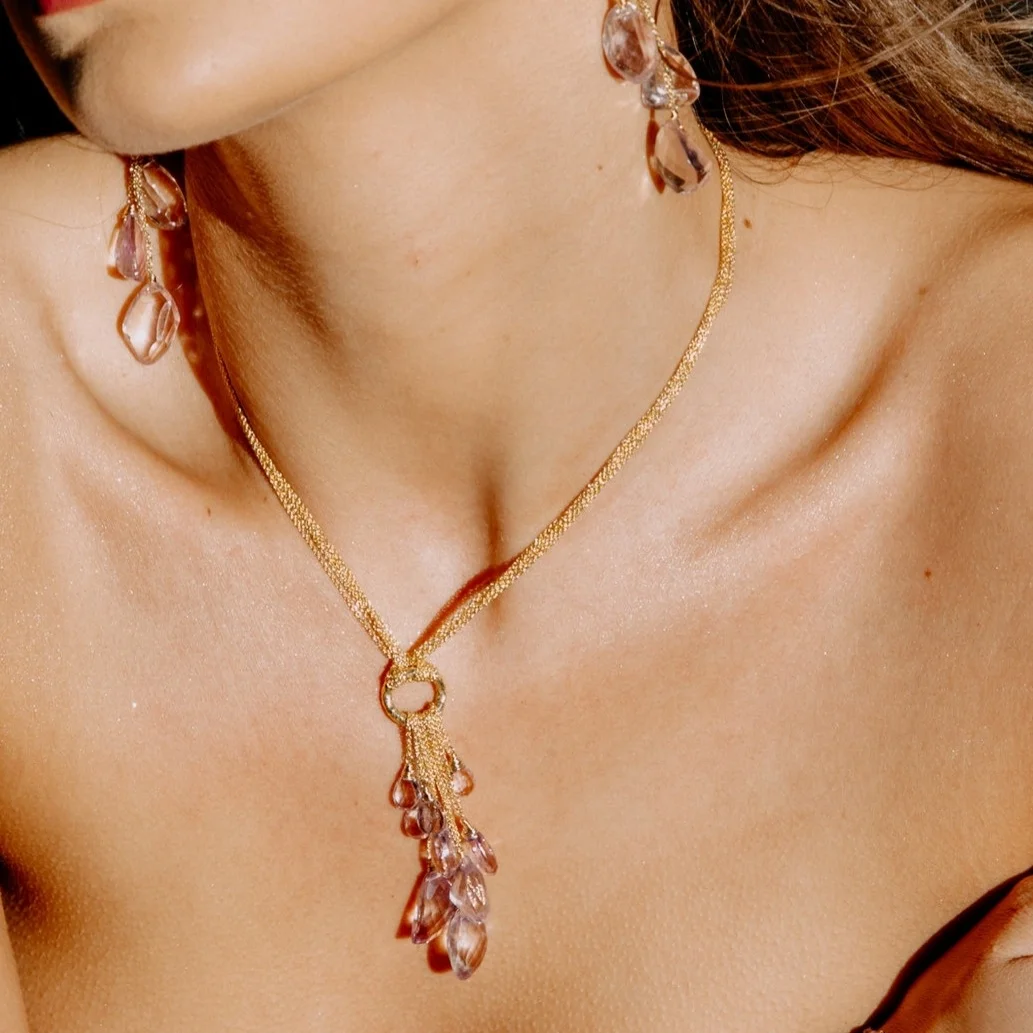 model wearing a pink amethyst multi drop and gold chain necklace