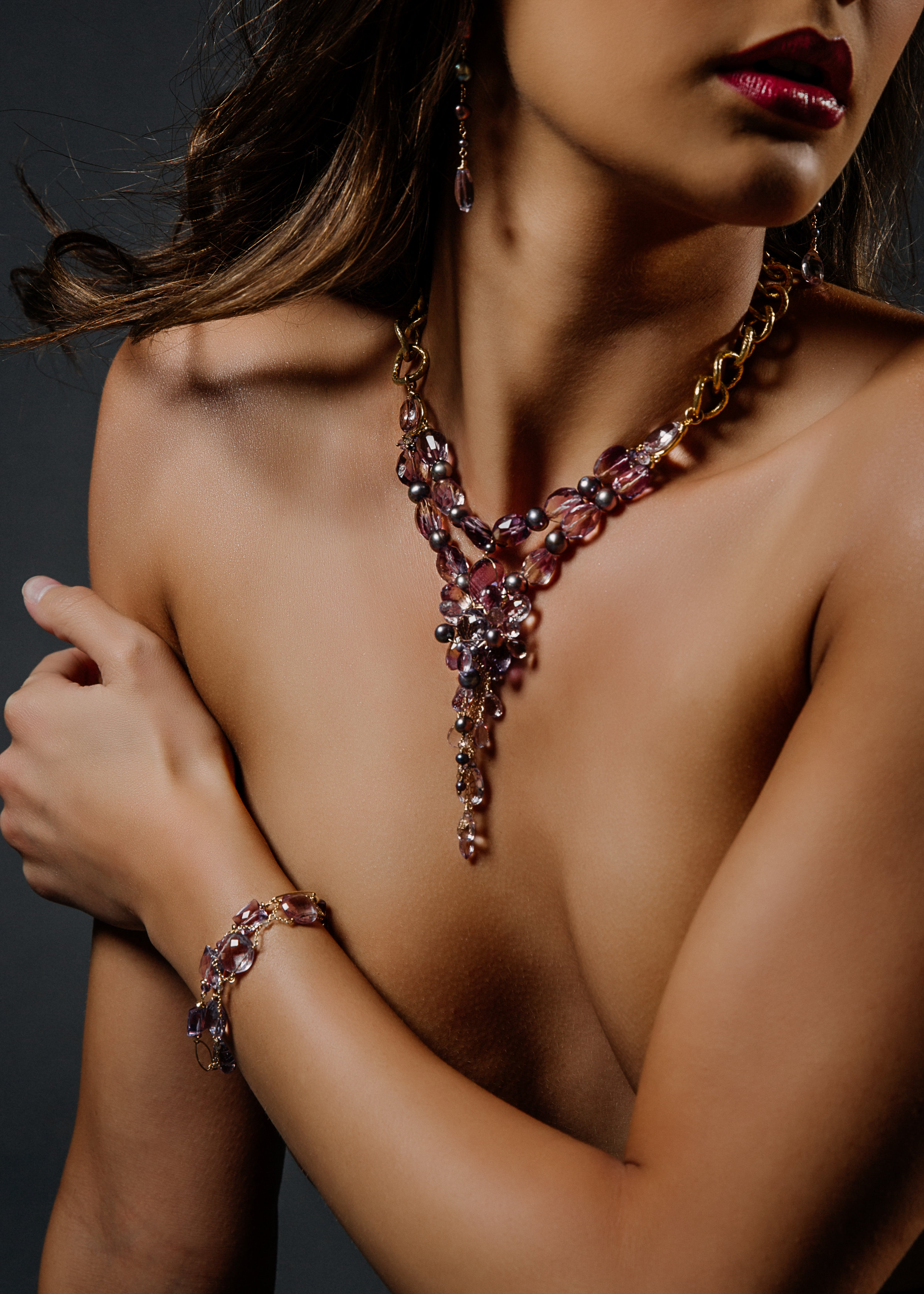 model wearing an ametrine, amethyst, pink amethyst, pearl multi drop statement necklace
