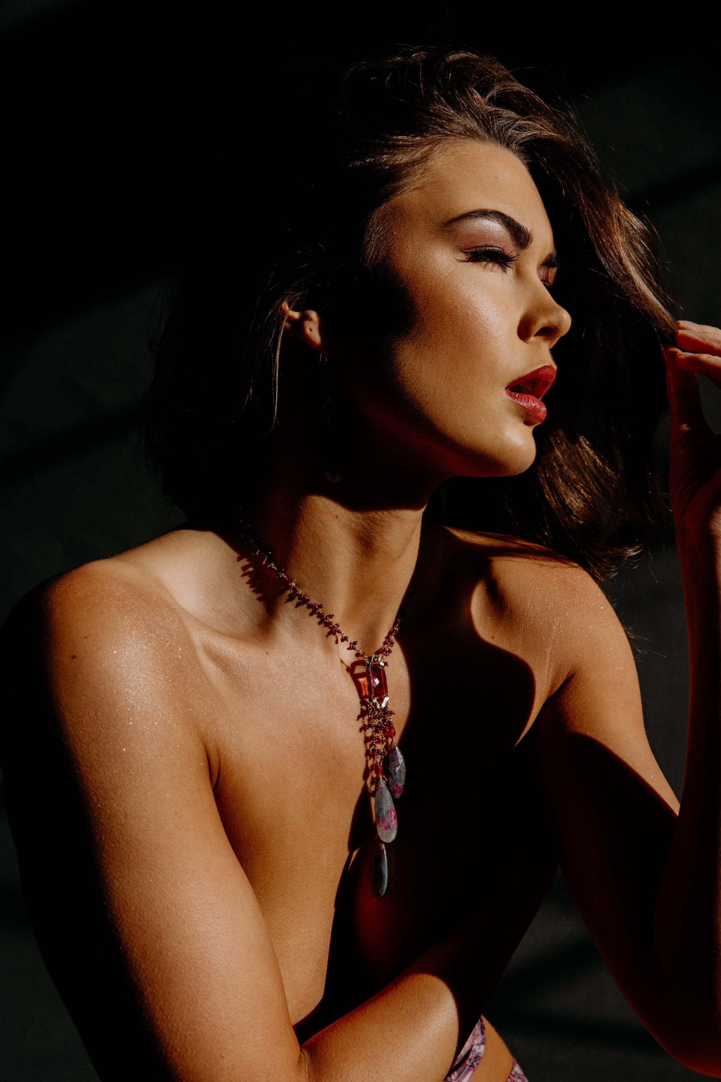 model wearing long sapphire earrings