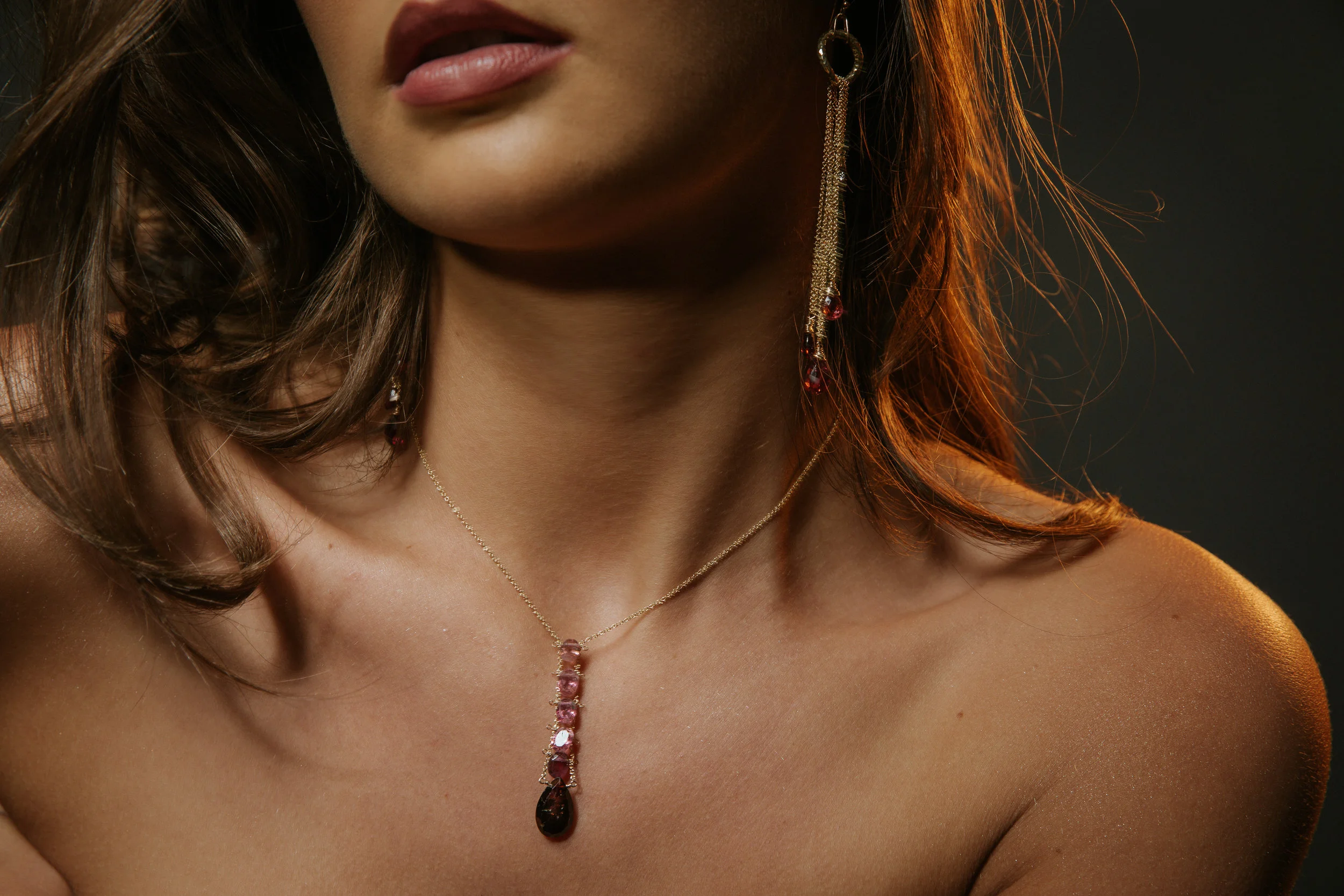 model wearing Pink tourmaline and garnet multi drop earrings