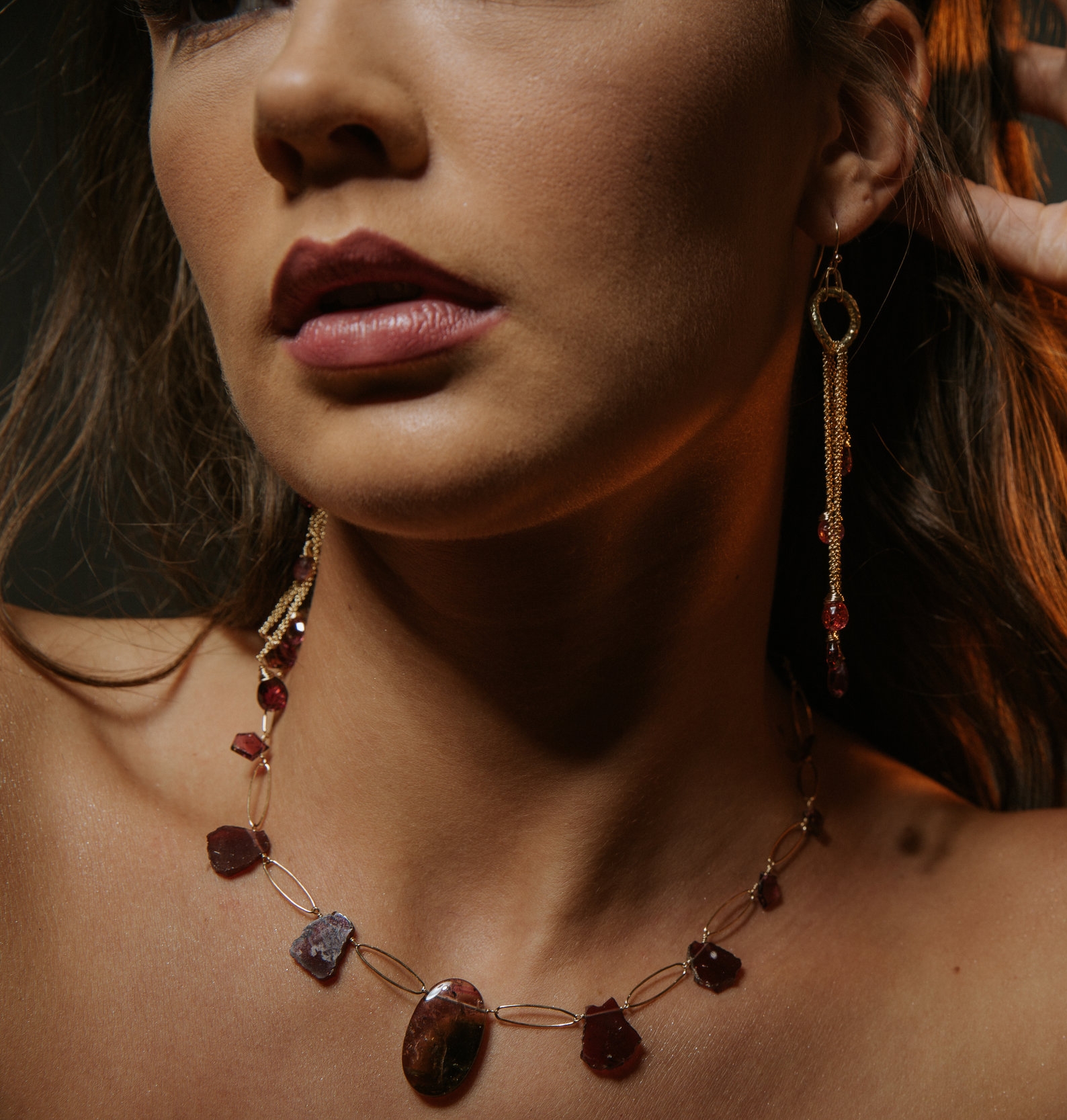 model wearing tourmaline and garnet necklace