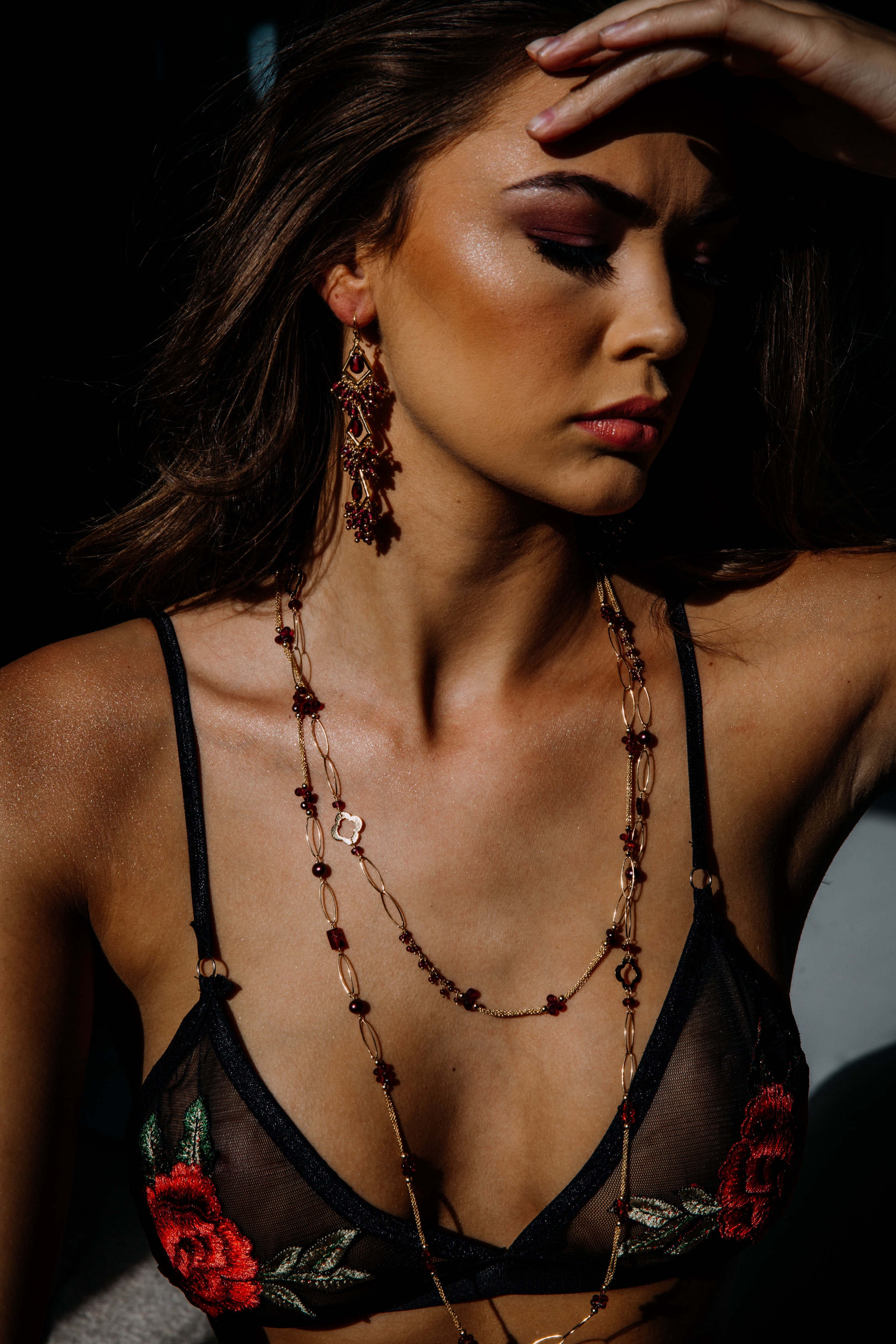 model wearing garnet layering necklace