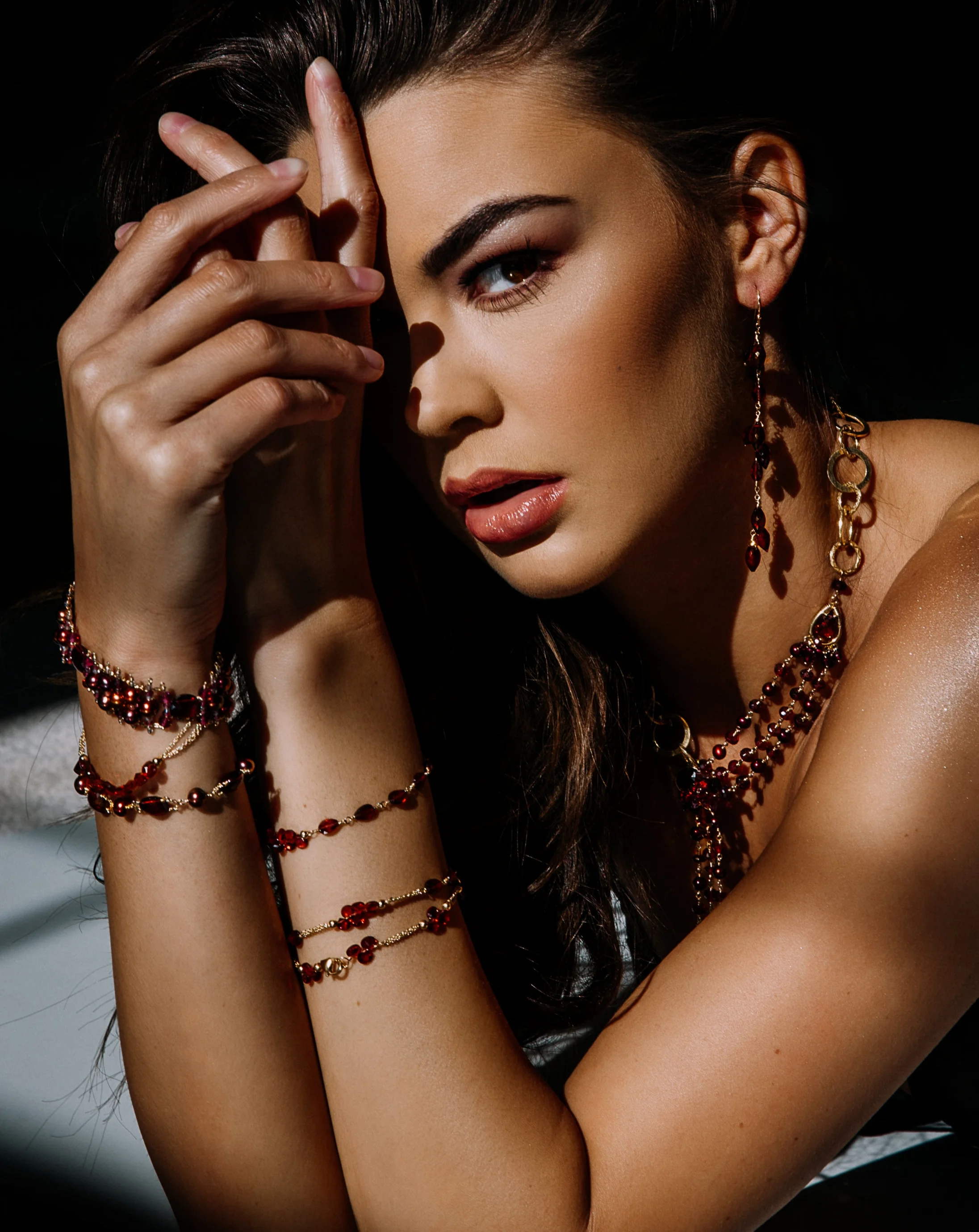 model wearing Multi chain garnet and pearl necklace