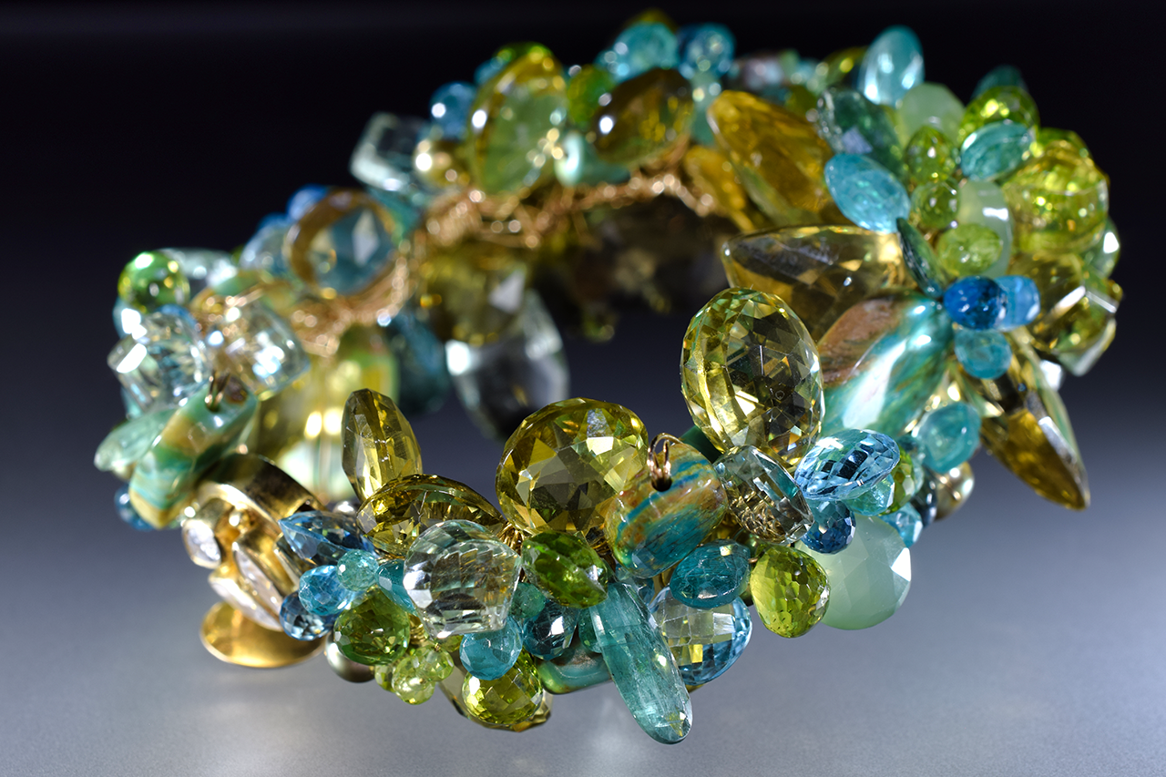 statement green and yellow gemstone and gold cuff bracelet