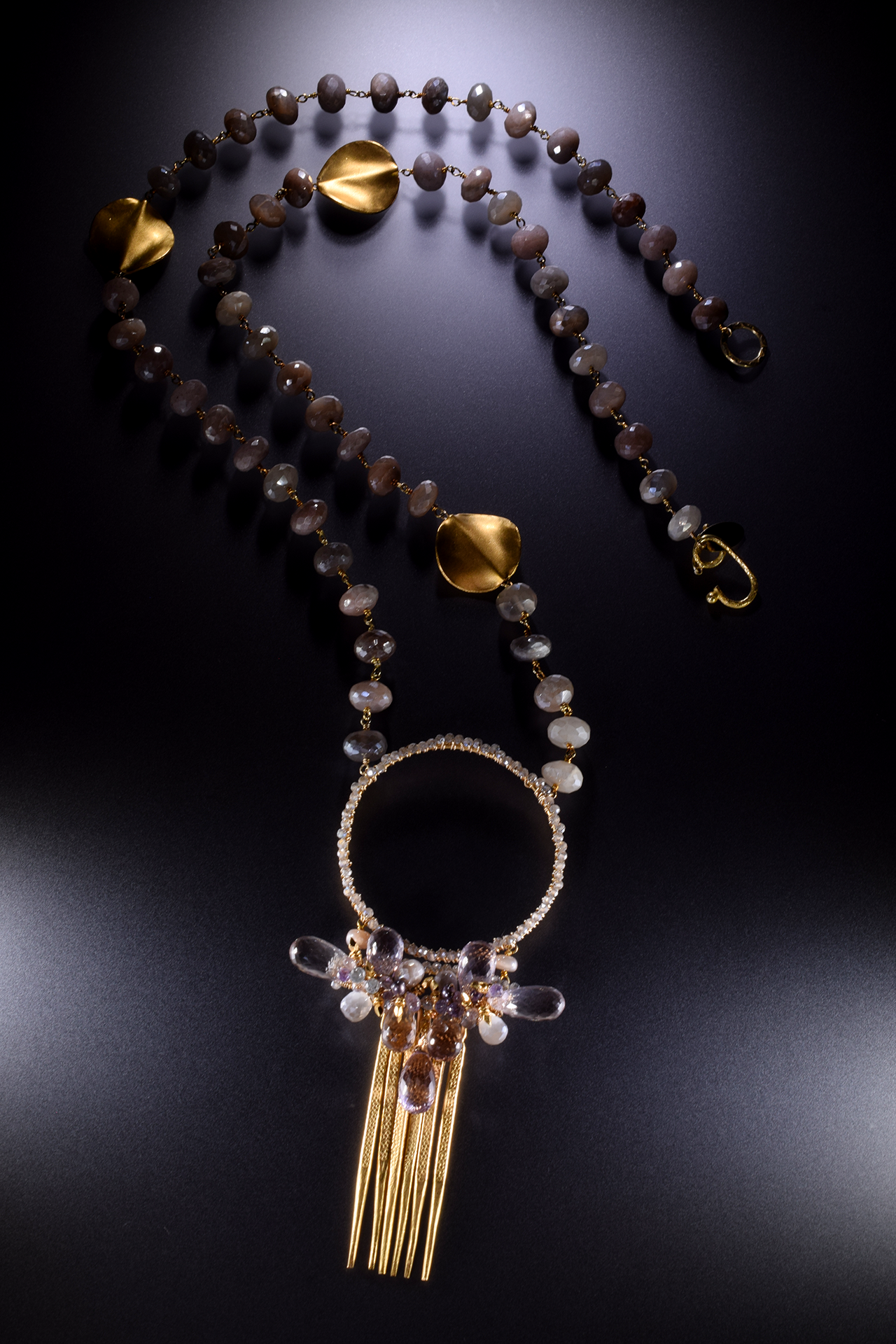 large circle pendant with gemstone drop with gold spike drops long necklace
