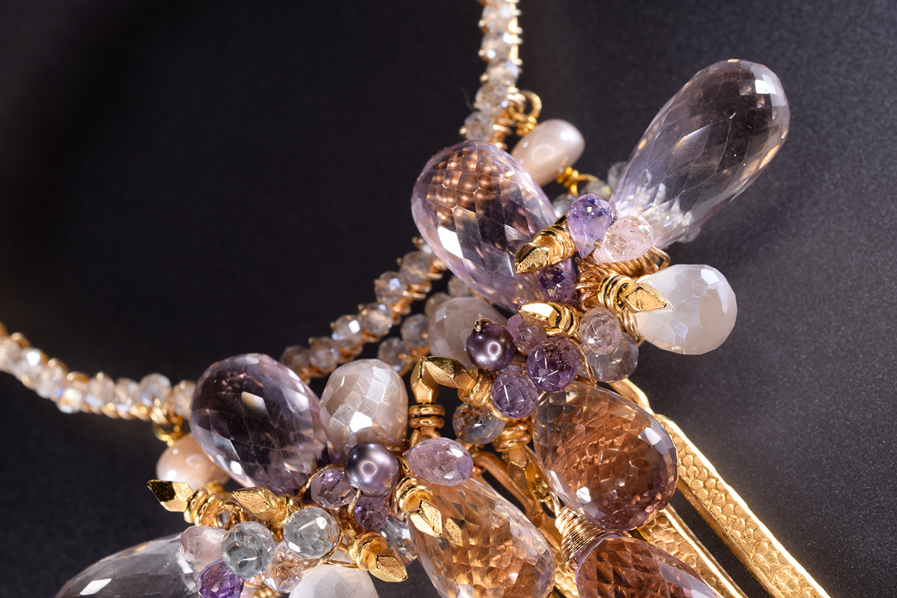 large circle pendant with gemstone drop with gold spike drops long necklace