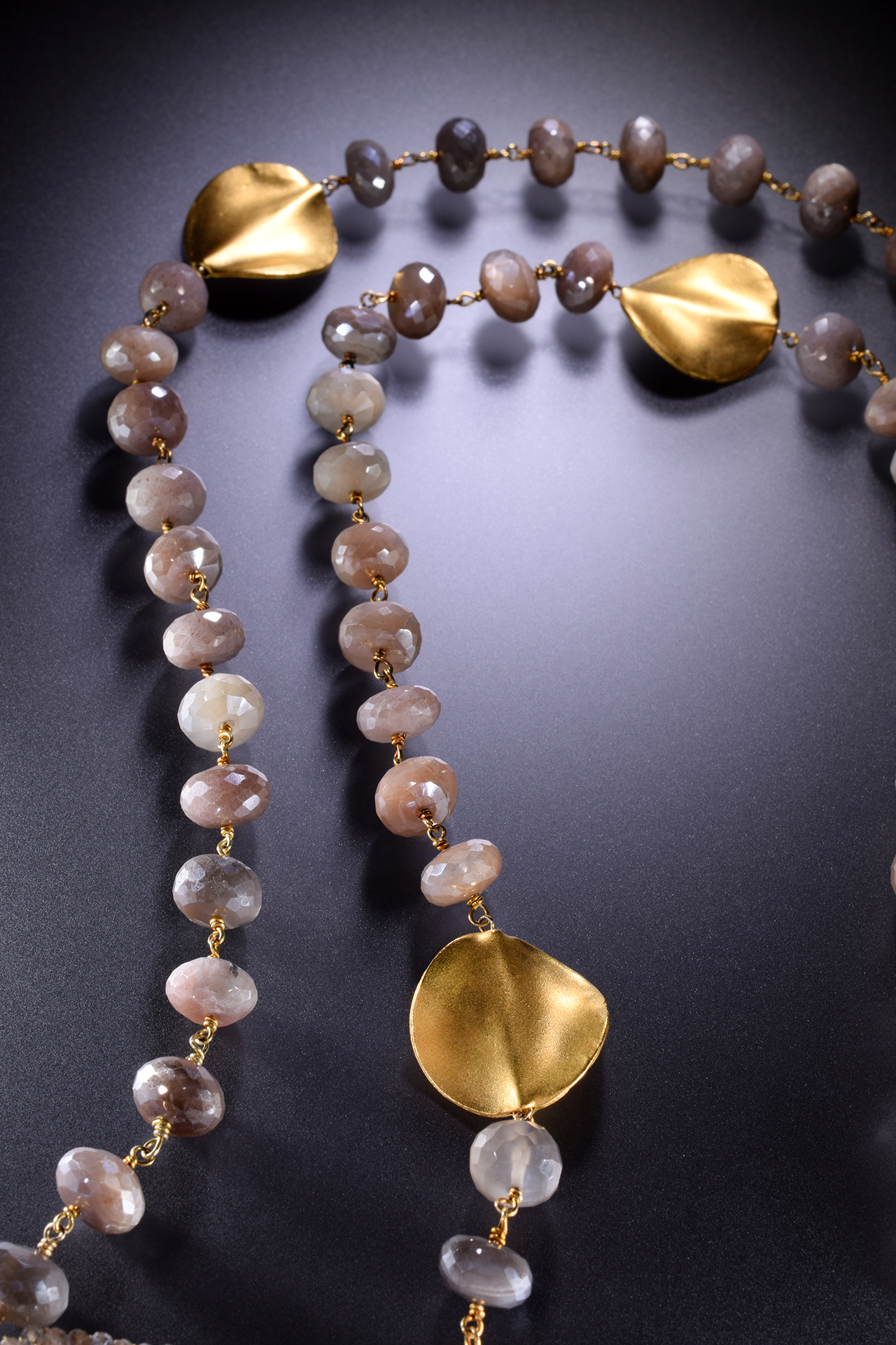 large circle pendant with gemstone drop with gold spike drops long necklace