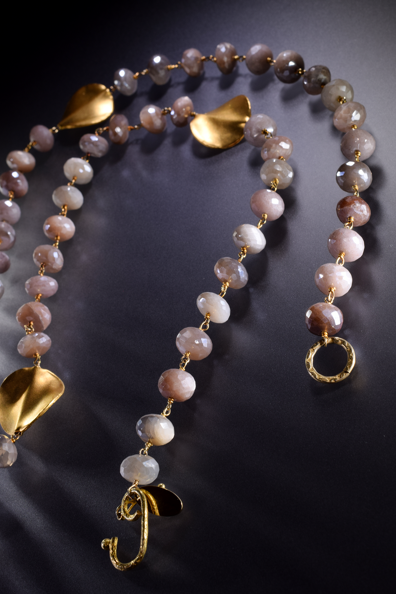 large circle pendant with gemstone drop with gold spike drops long necklace