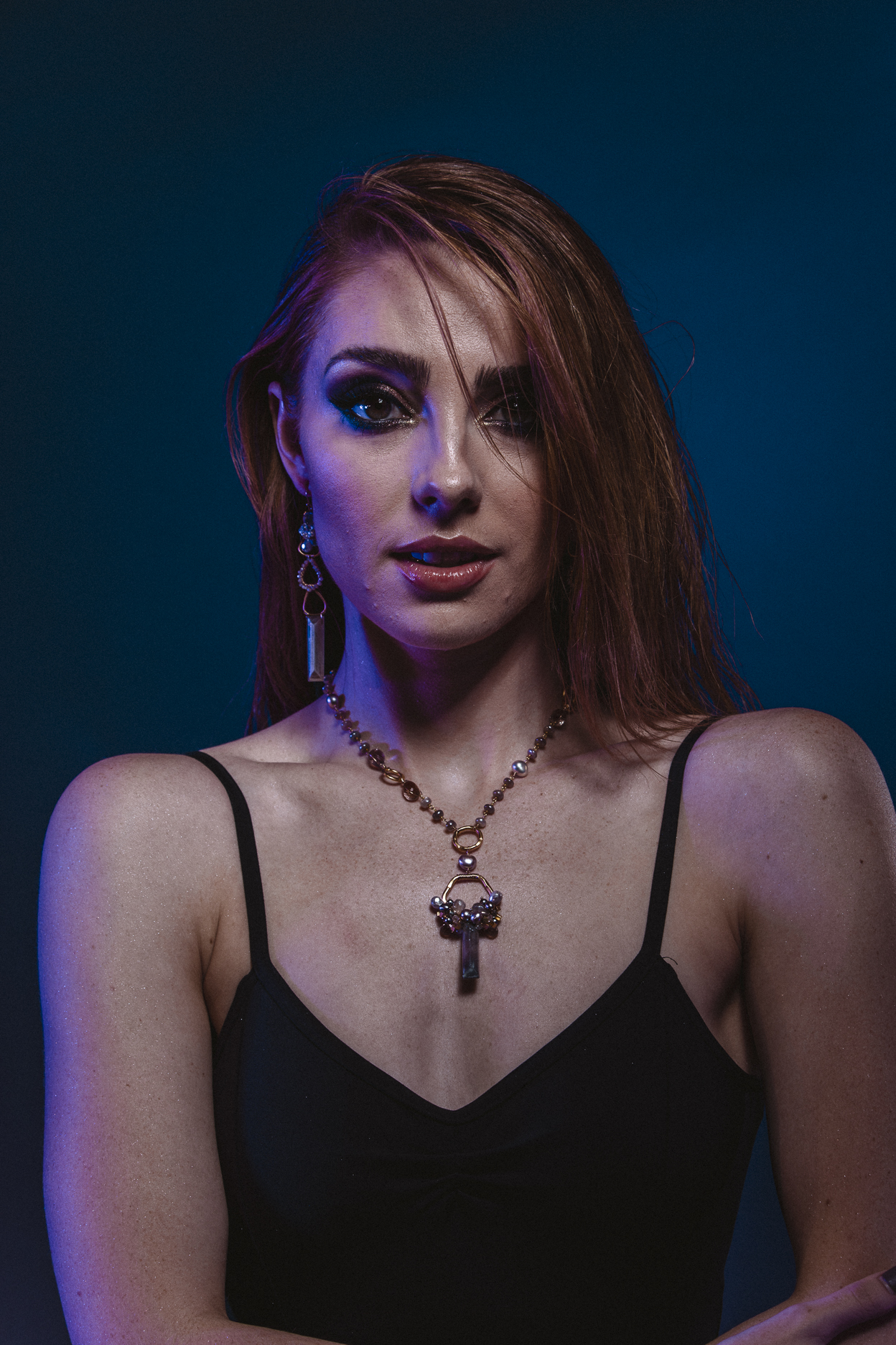model wearing gemstone pearl cluster moonstone rectangle drop gold necklace
