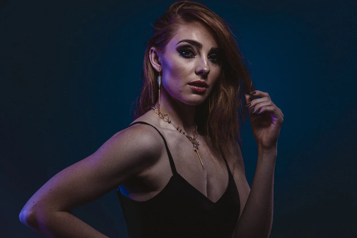 model wearing single gold spike gemstone pearl drop necklace
