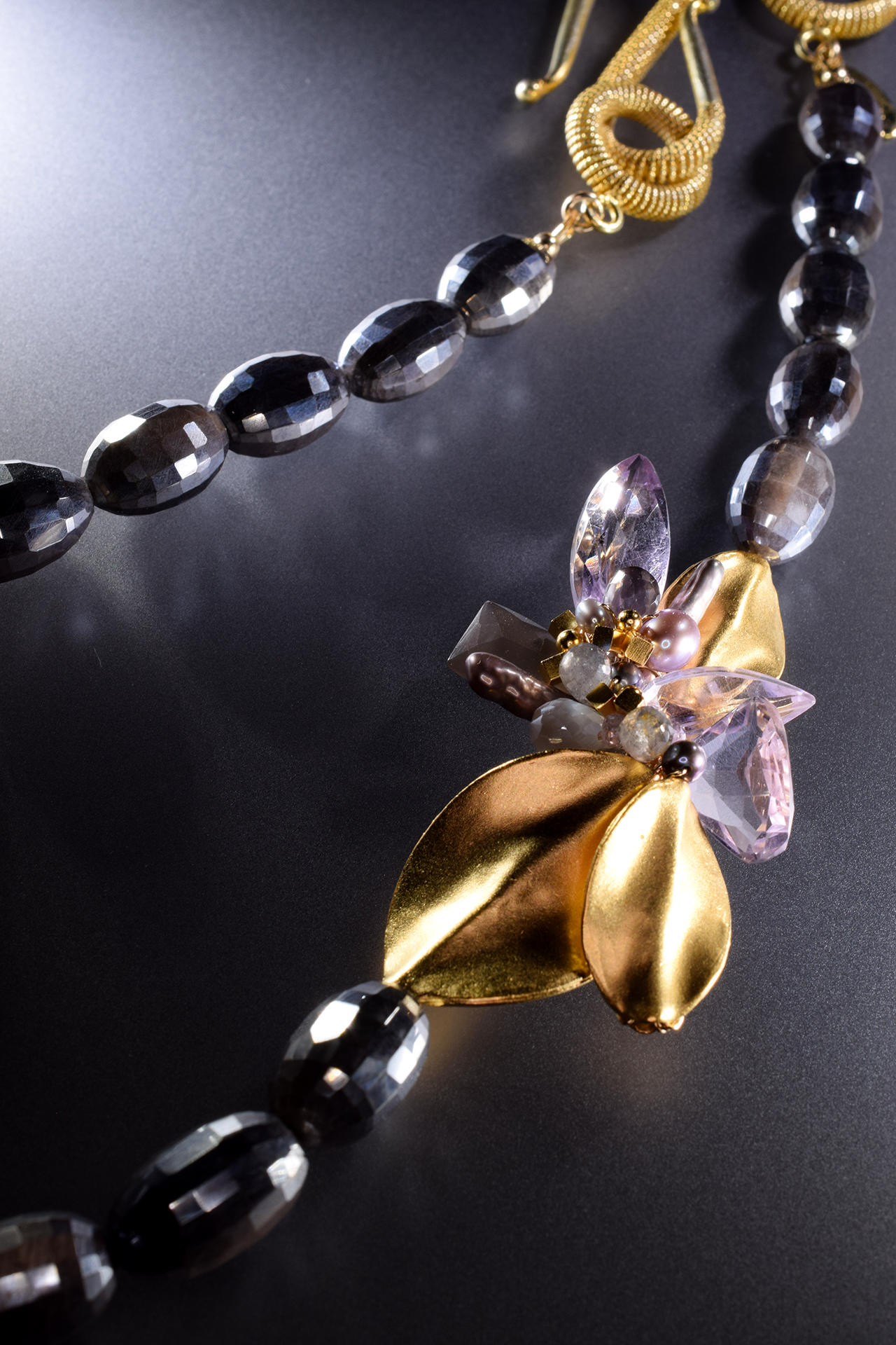 round faceted moonstone with side gemstone pearl gold accent