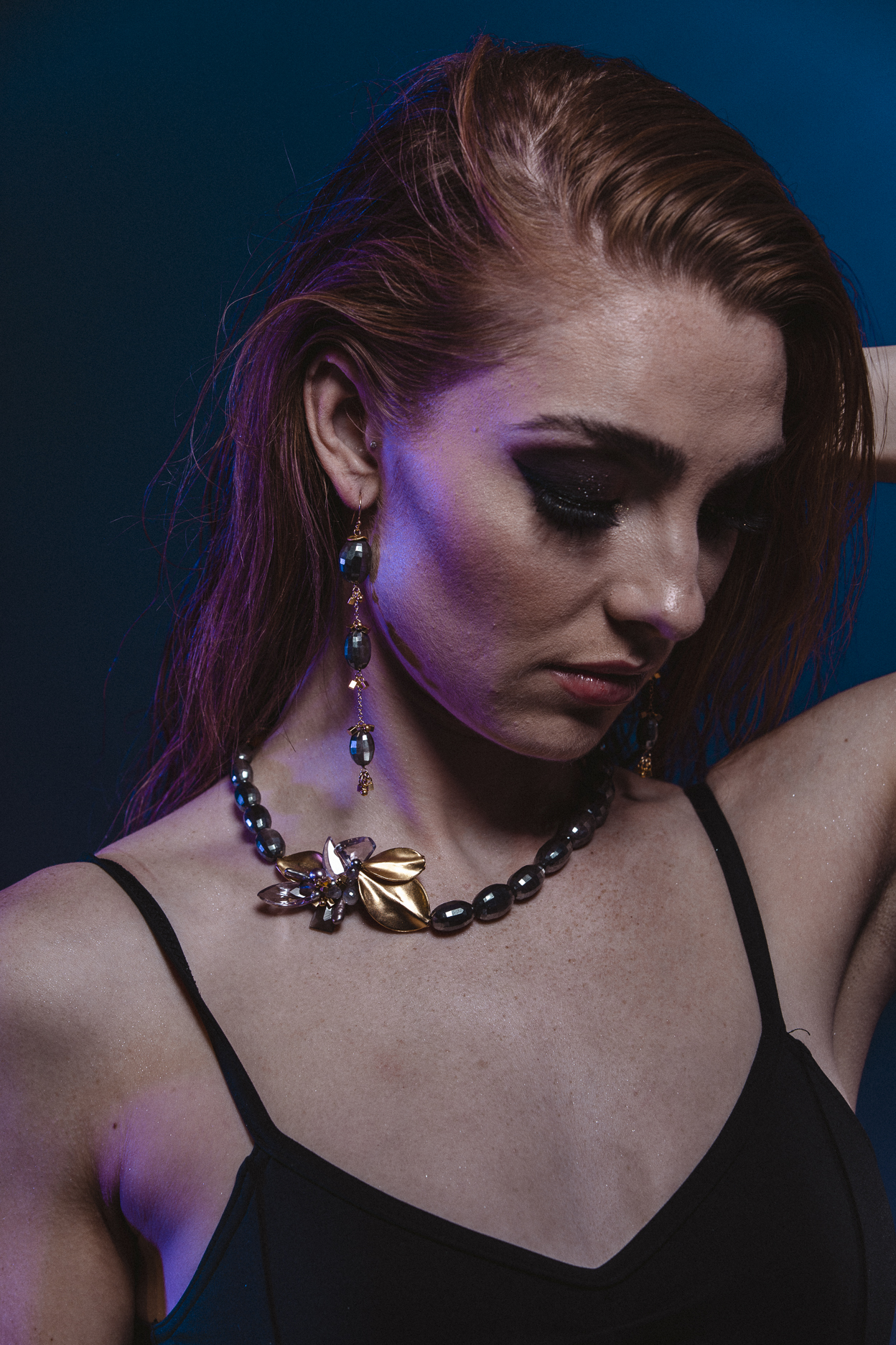 model wearing round faceted moonstone with side gemstone pearl gold accent