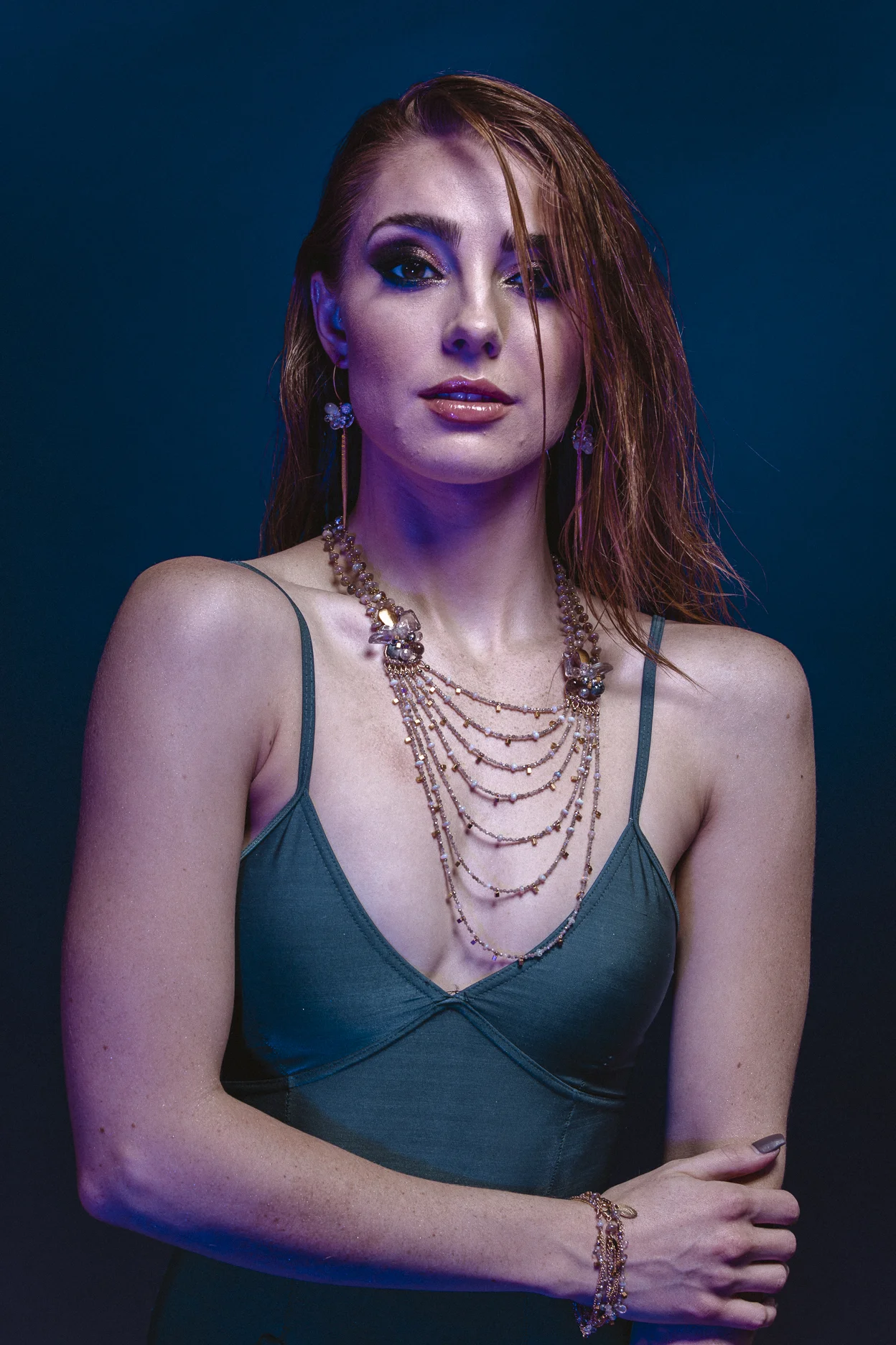 Model wearing layering bracelets