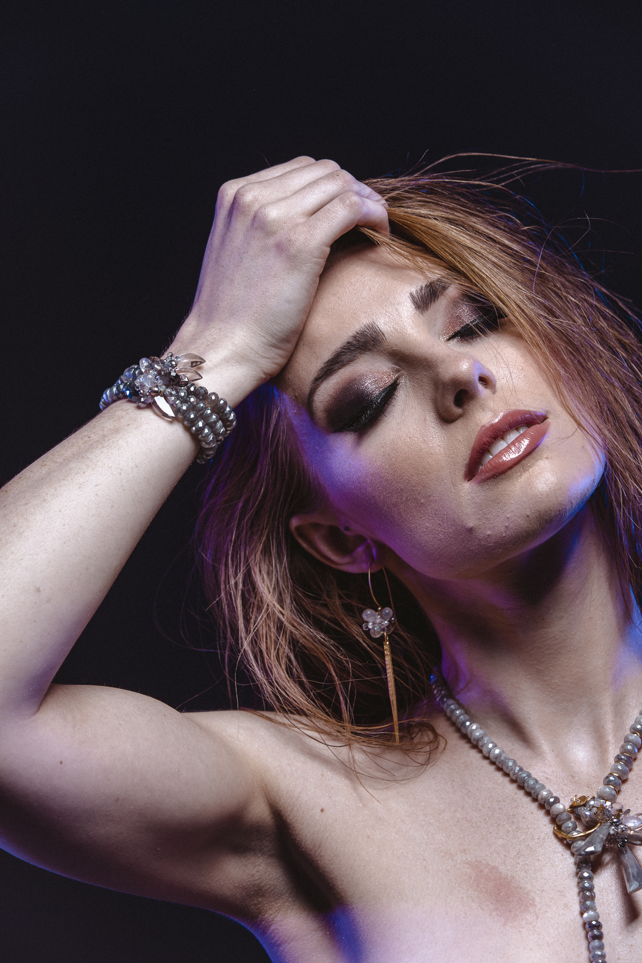model wearing triple strand gemstone pearl cuff bracelet