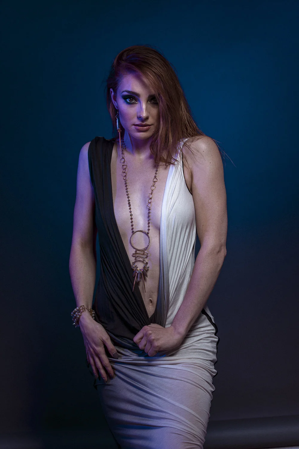 model wearing Multi circle gemstone and pearl encrusted drop pendant long gold necklace
