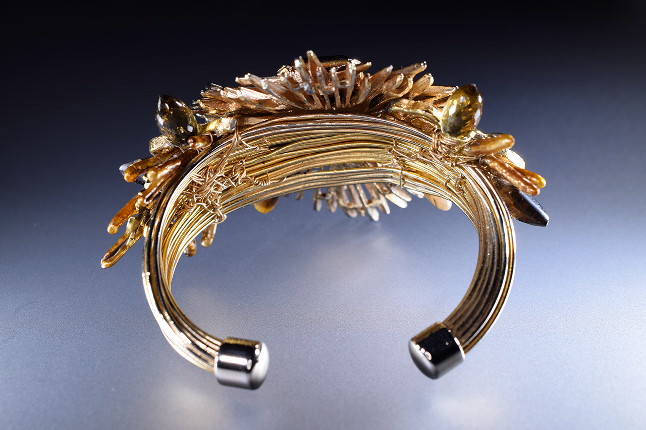gold starburst and gemstone cuff bracelet
