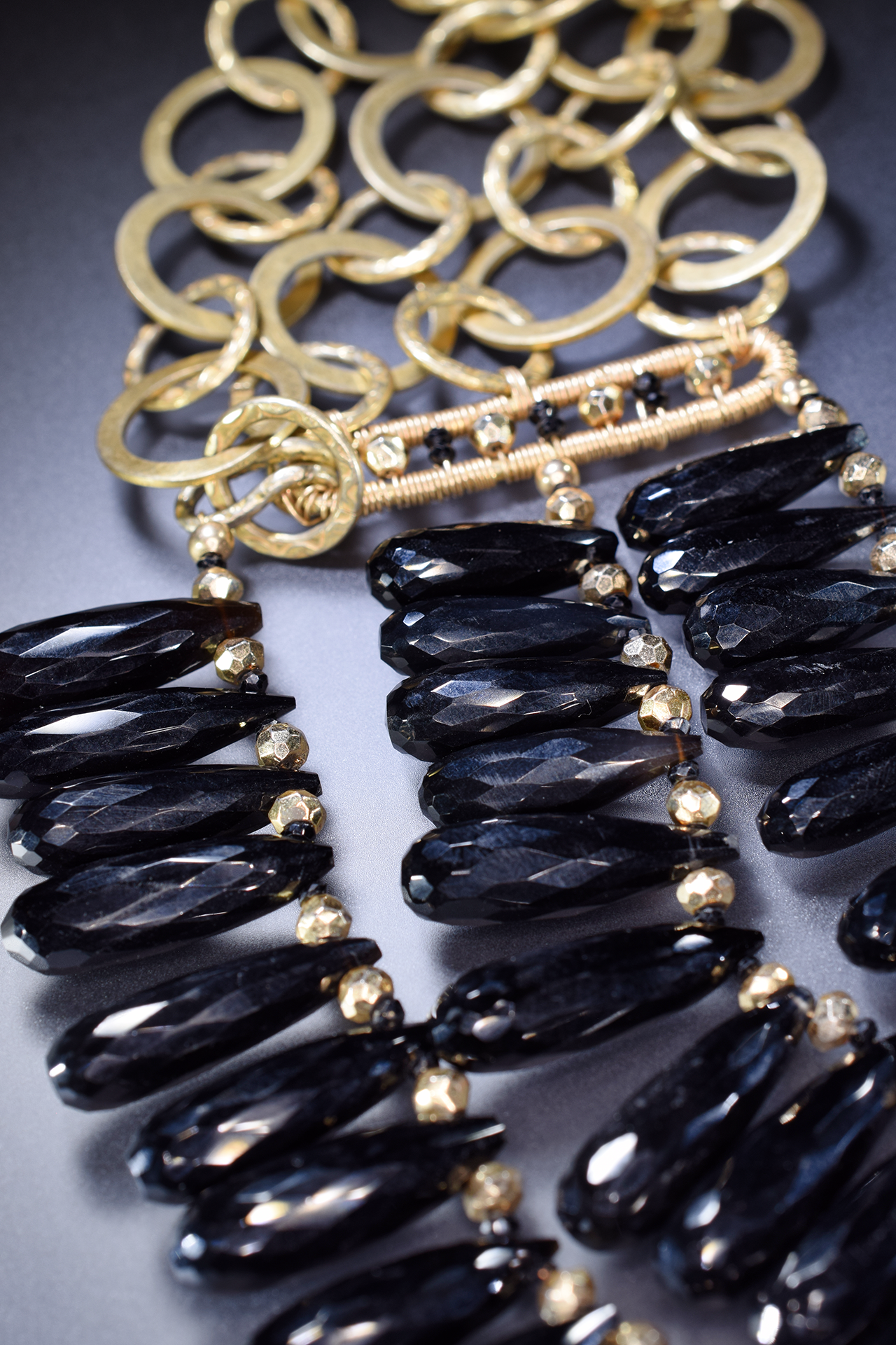black spinel triple strand gold necklace