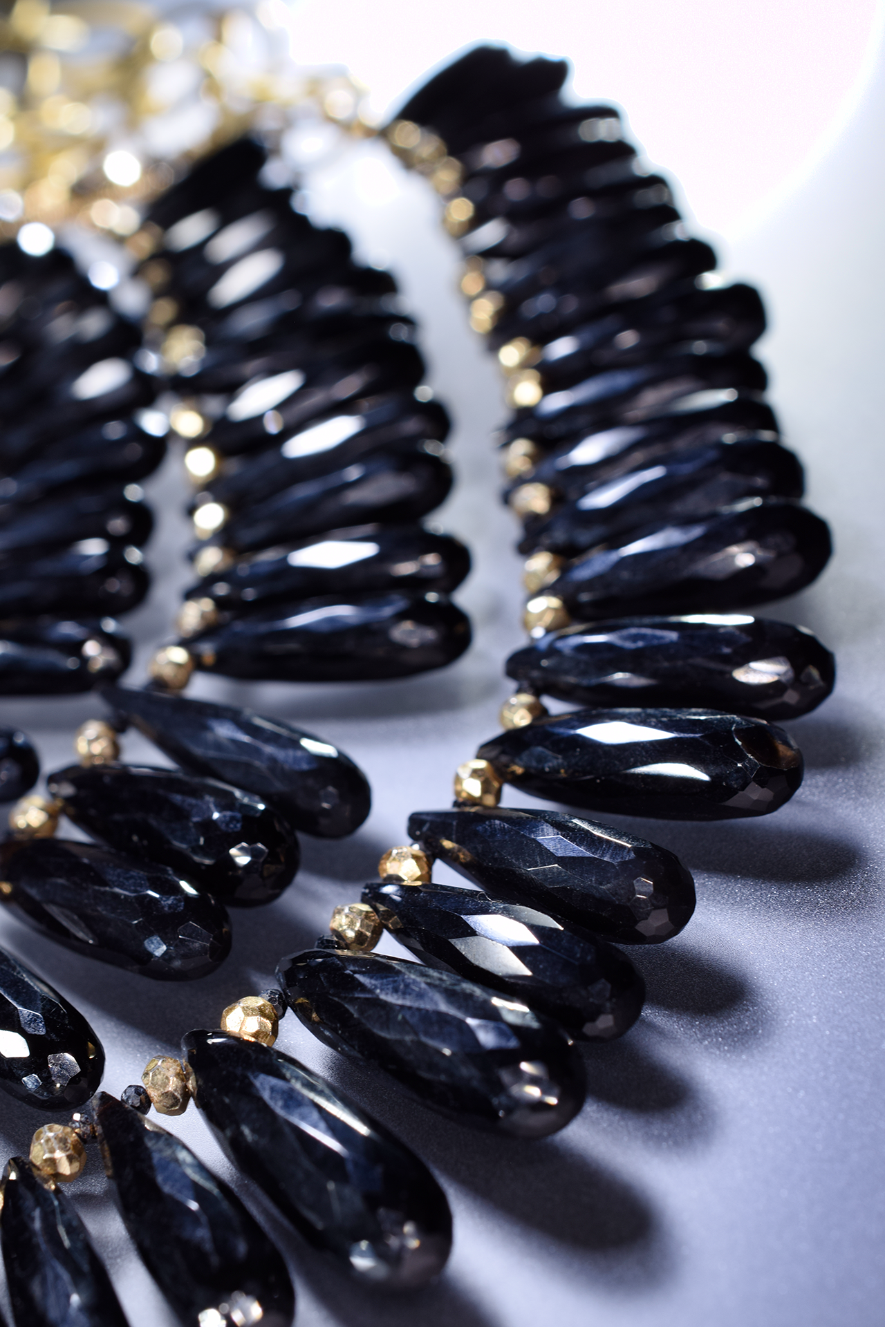 black spinel triple strand gold necklace