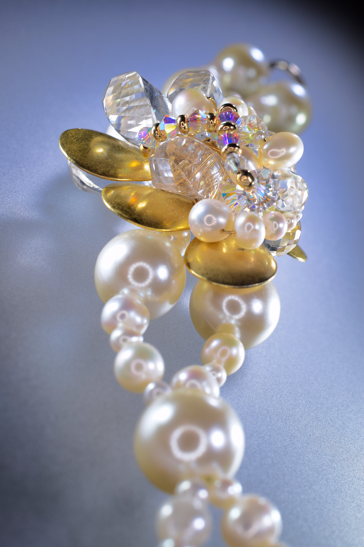 double pearl strand with Swarovski crystals and gold bracelet