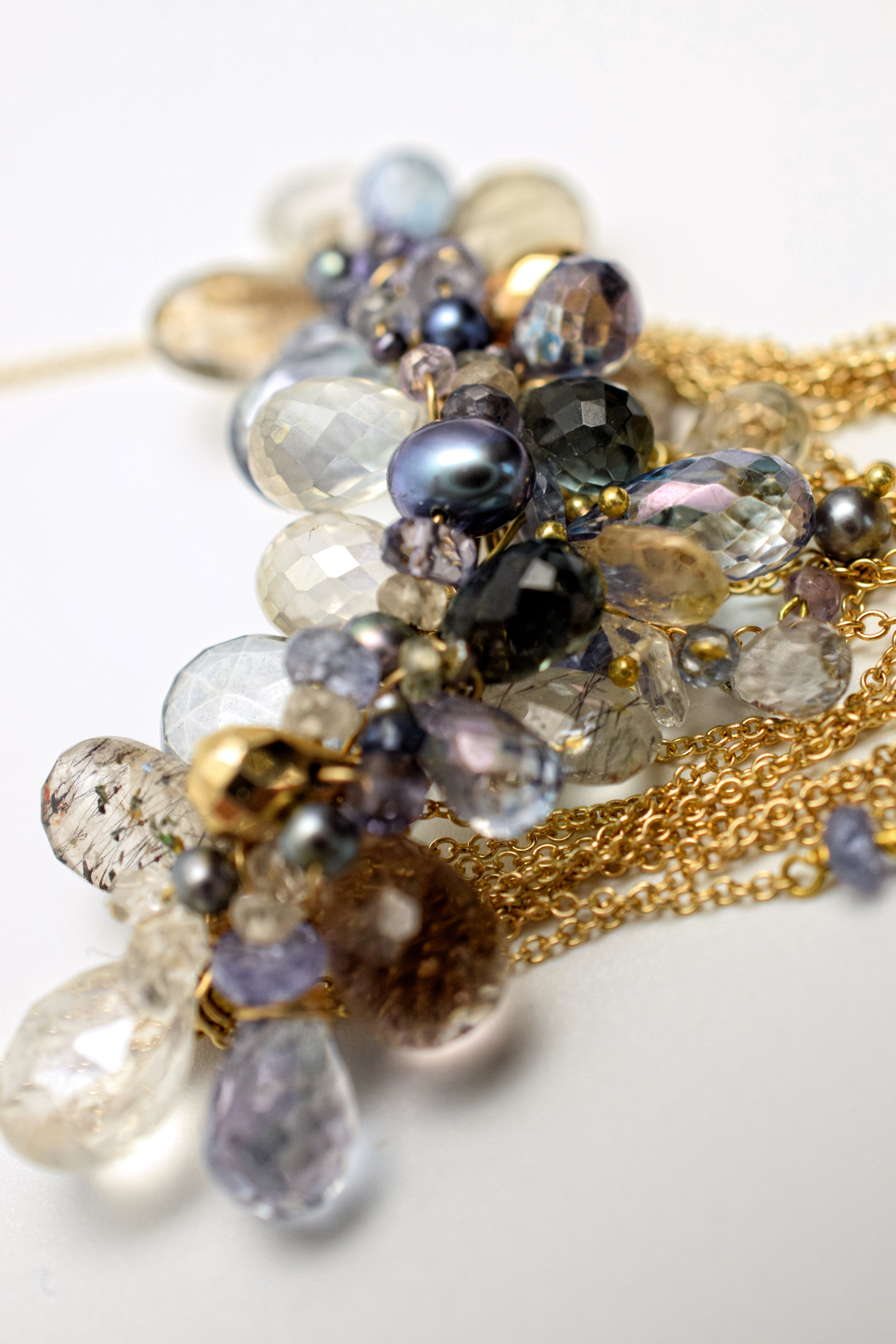 multi-drop gemstone necklace with delicate gold chains
