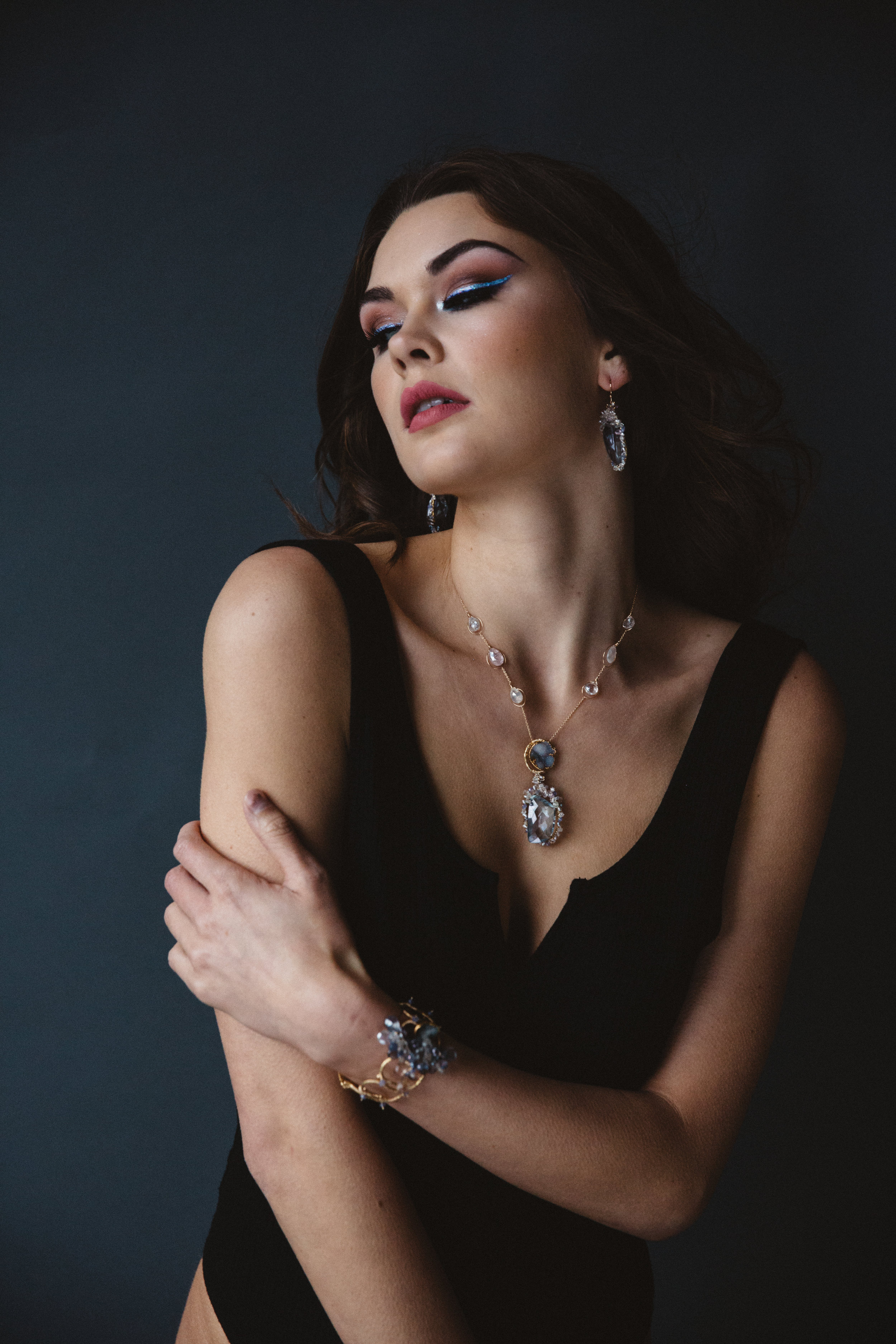 model wearing sapphire and druzy pendant necklace