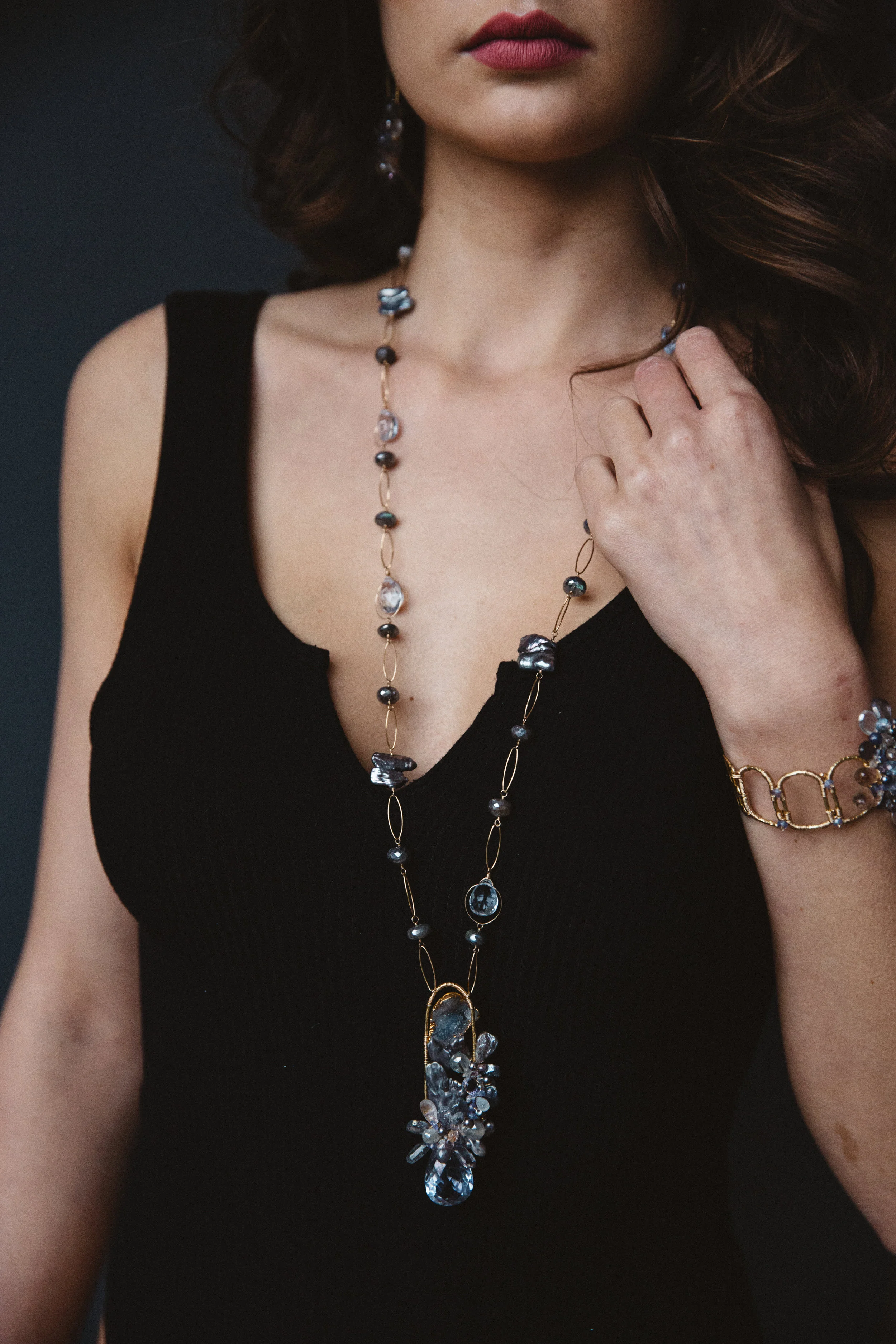 model wearing gemstone cluster pendant necklace