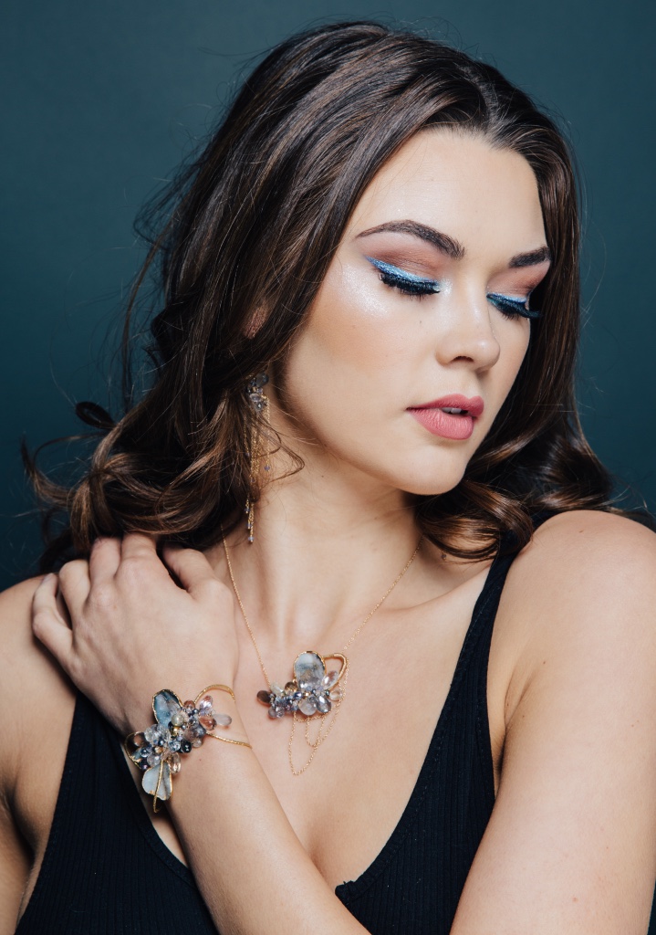model wearing gemstone and druzy pendant necklace