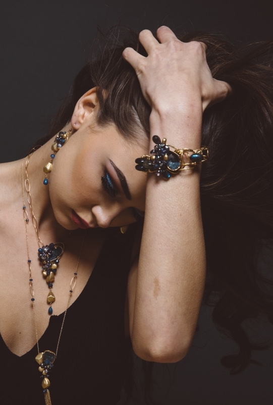model wearing gemstone and druzy cuff bracelet