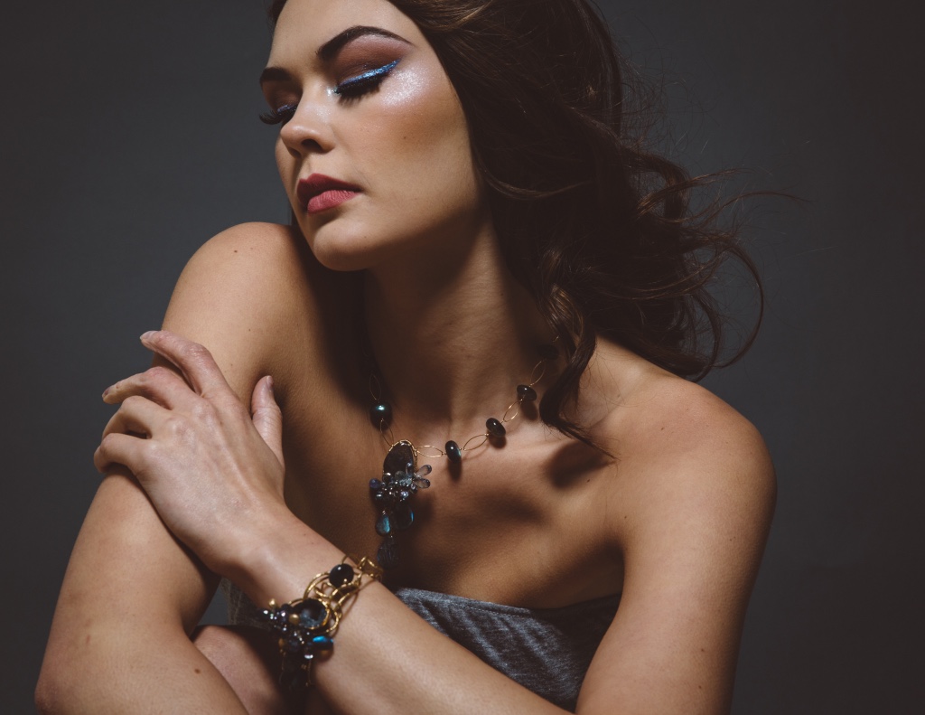 model wearing gemstone and druzy cuff bracelet