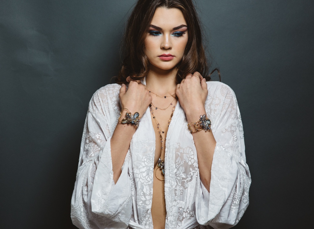 model wearing gemstone druzy pearl gold link cuff bracelet