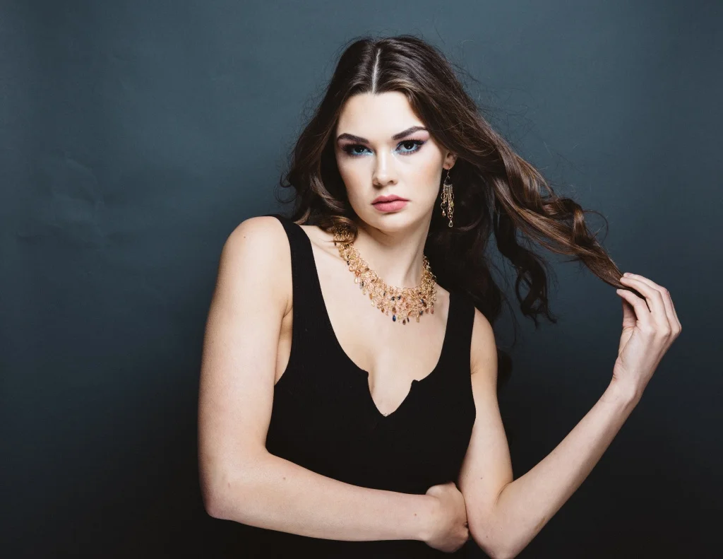 model wearing padparadscha sapphire fancy trillion cut quartz gold link multi drop earrings