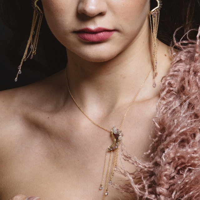 model wearing pink sapphire multi gold chain drop earrings