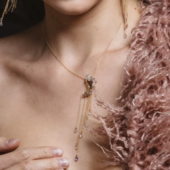 model wearing pink sapphire multi gold chain drop necklace