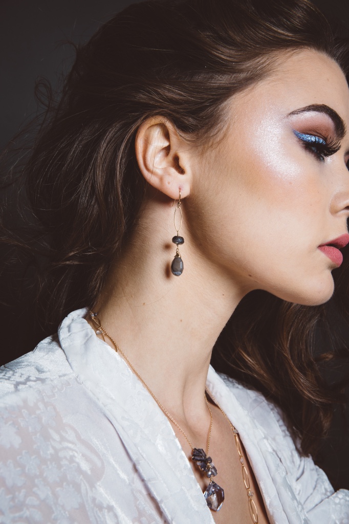 model wearing mystic labradorite pearlized moonstone gold drop earrings