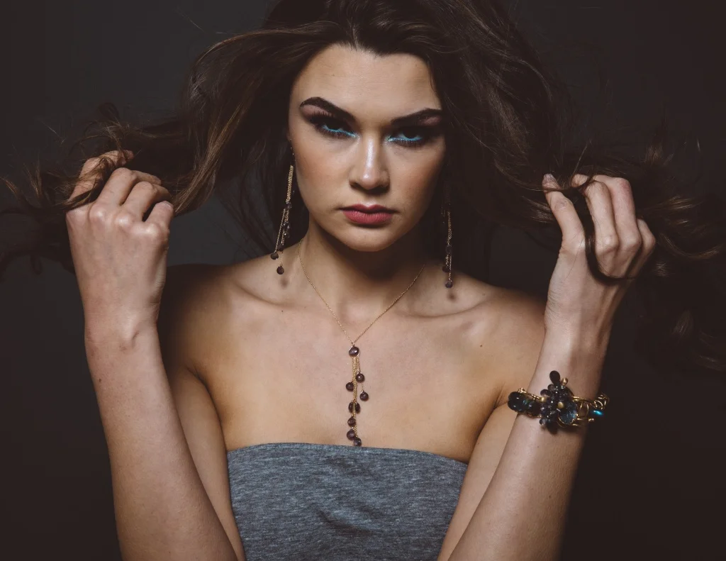 model wearing iolite multi gold chain drop earrings