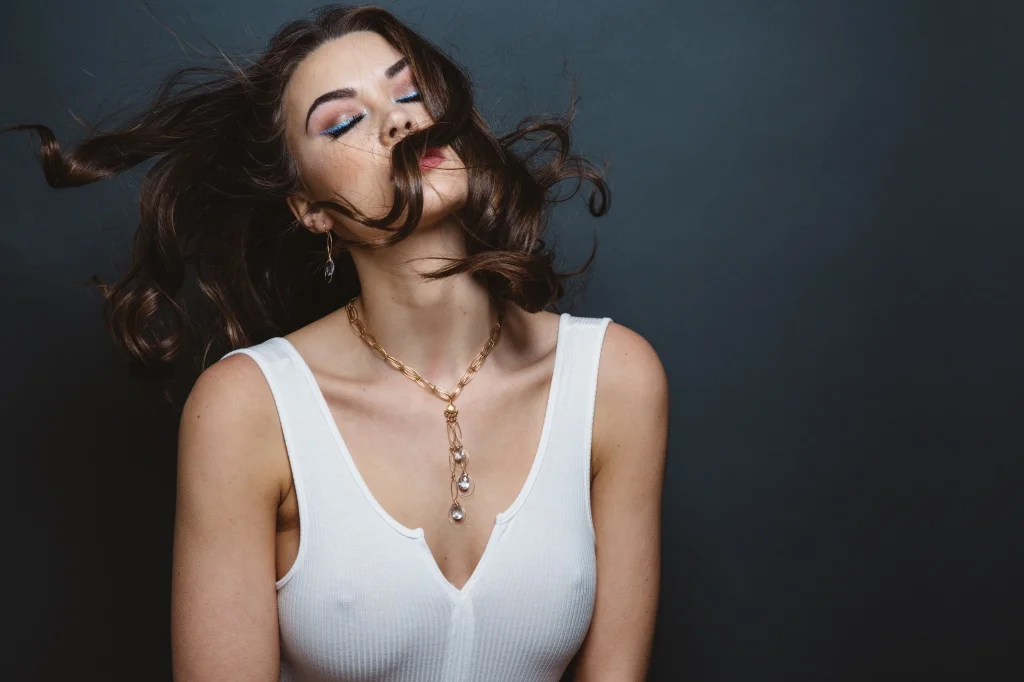 model wearing fancy cut quartz multi drop gold chain link necklace