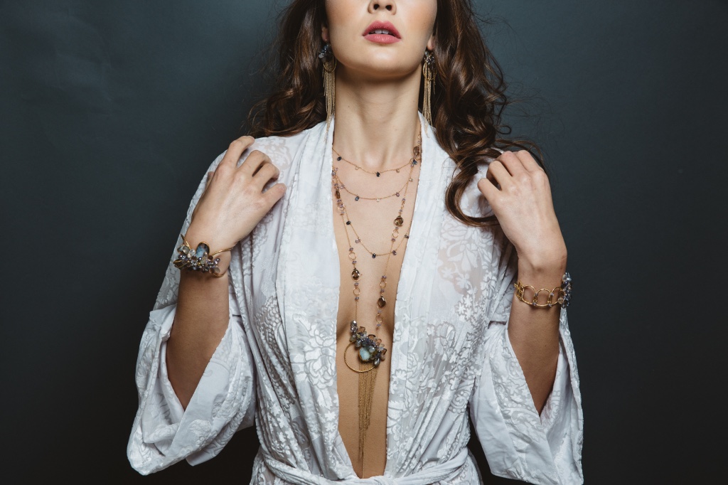 model wearing gemstone druzy pearl circle pendant with gold chain tassel long necklace