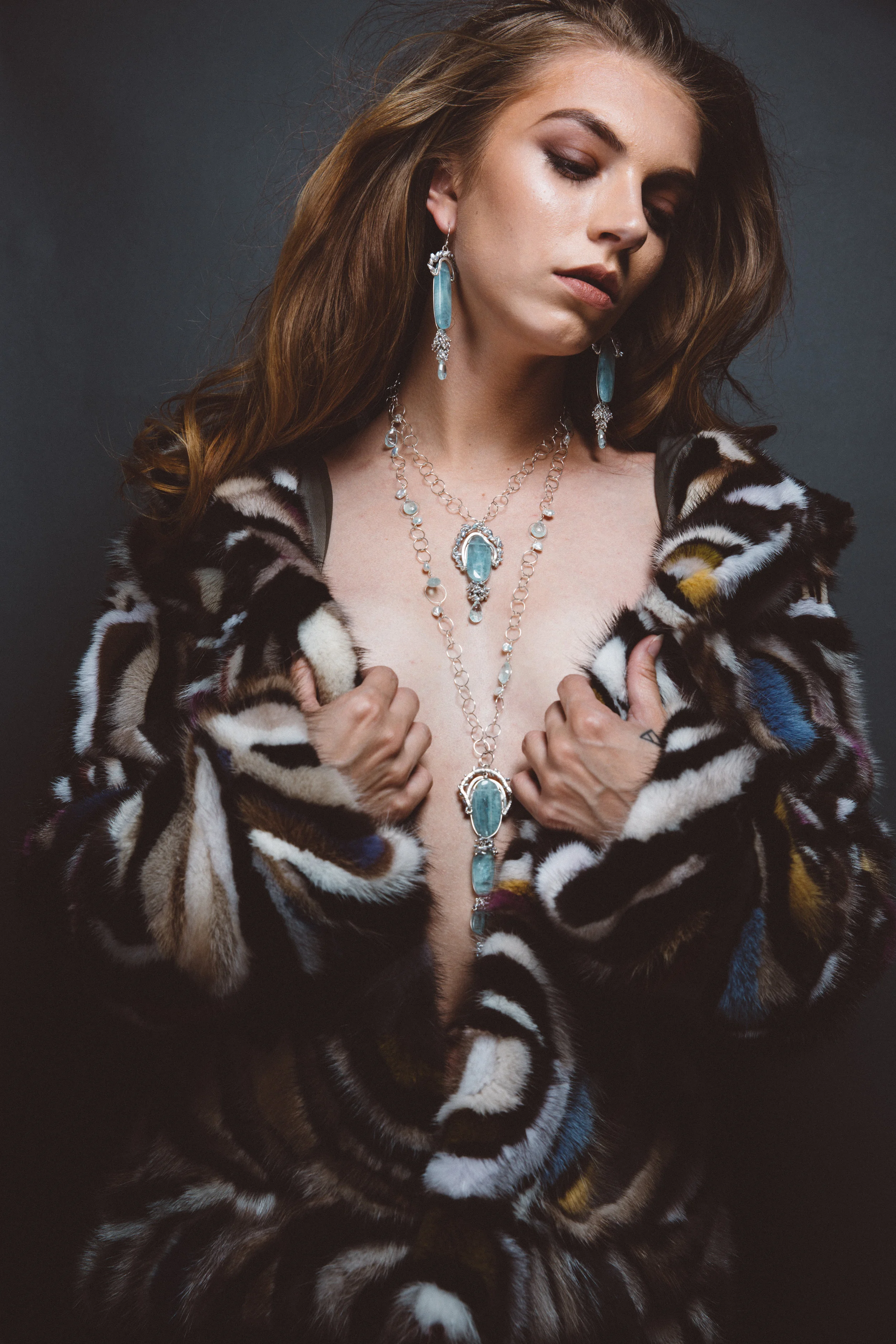 model wearing aquamarine pendant with keshi pearls and sterling silver