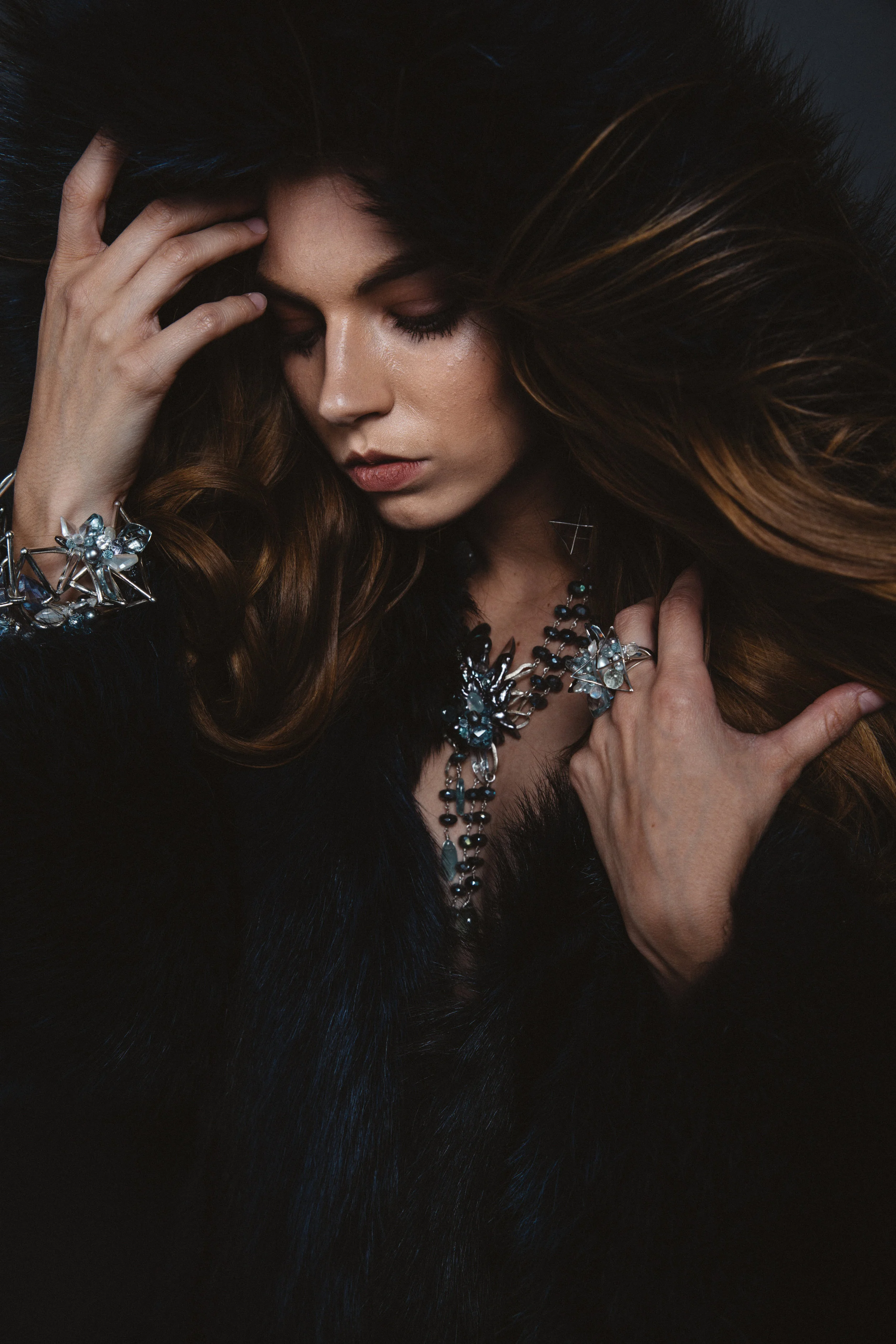 model wearing a statement gemstone necklace