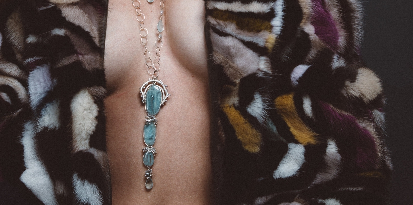 model wearing triple drop aquamarine long necklace