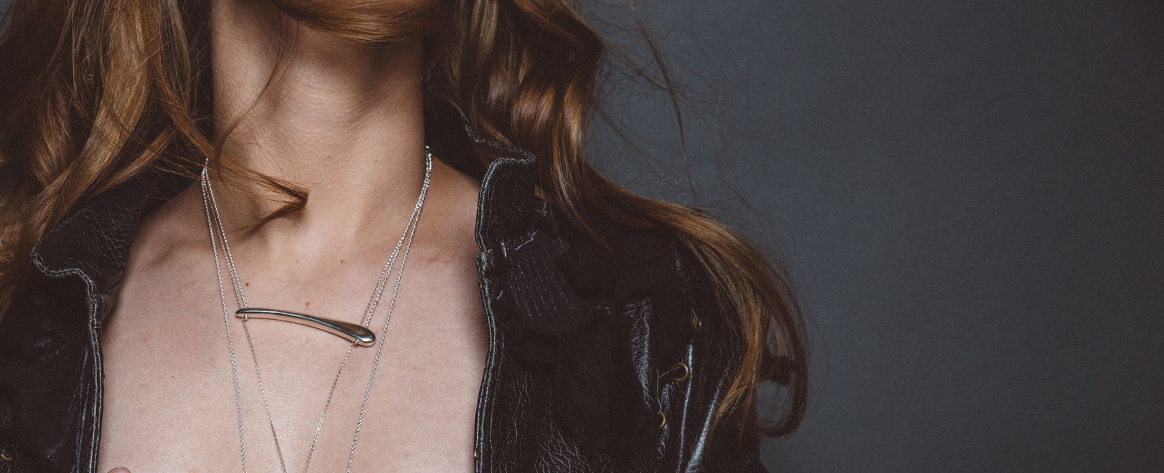 model wearing sterling silver casted bar necklace