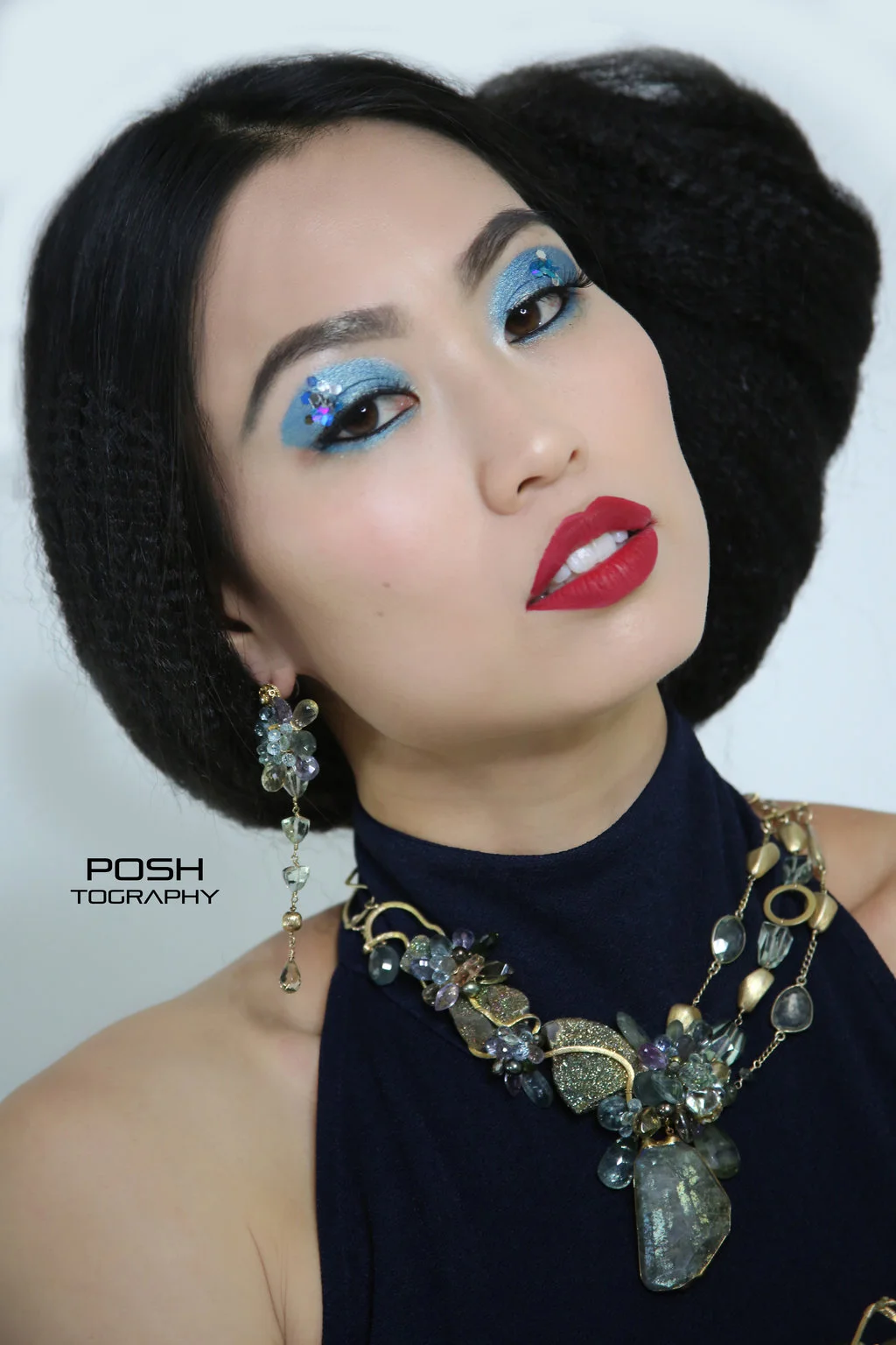 model wearing a gemstone statement necklace