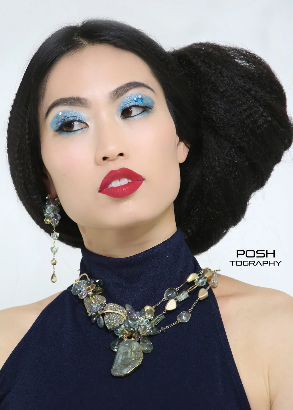 model wearing a gemstone statement necklace