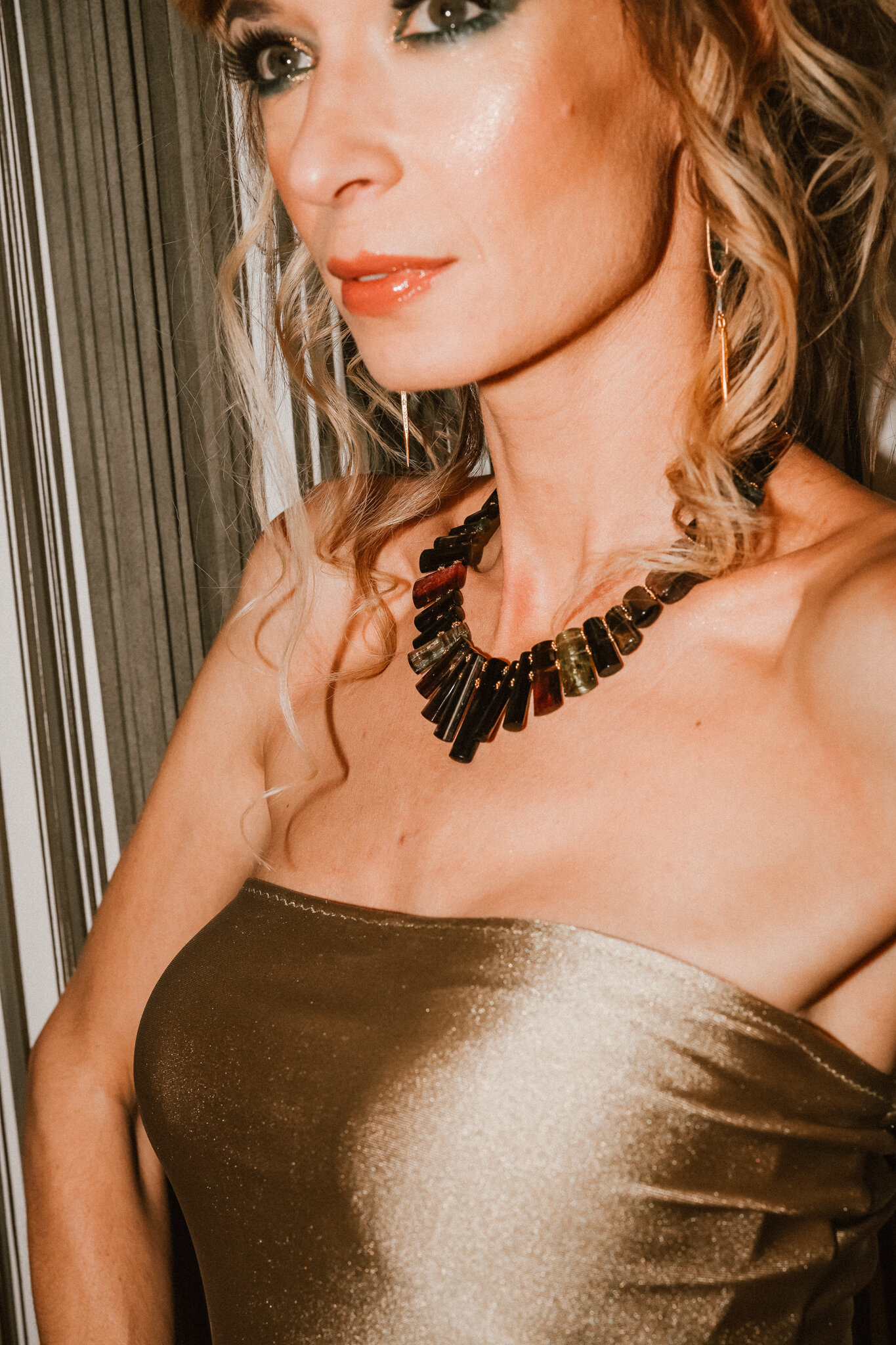 Model wearing tourmaline and solid 18k gold collar necklace