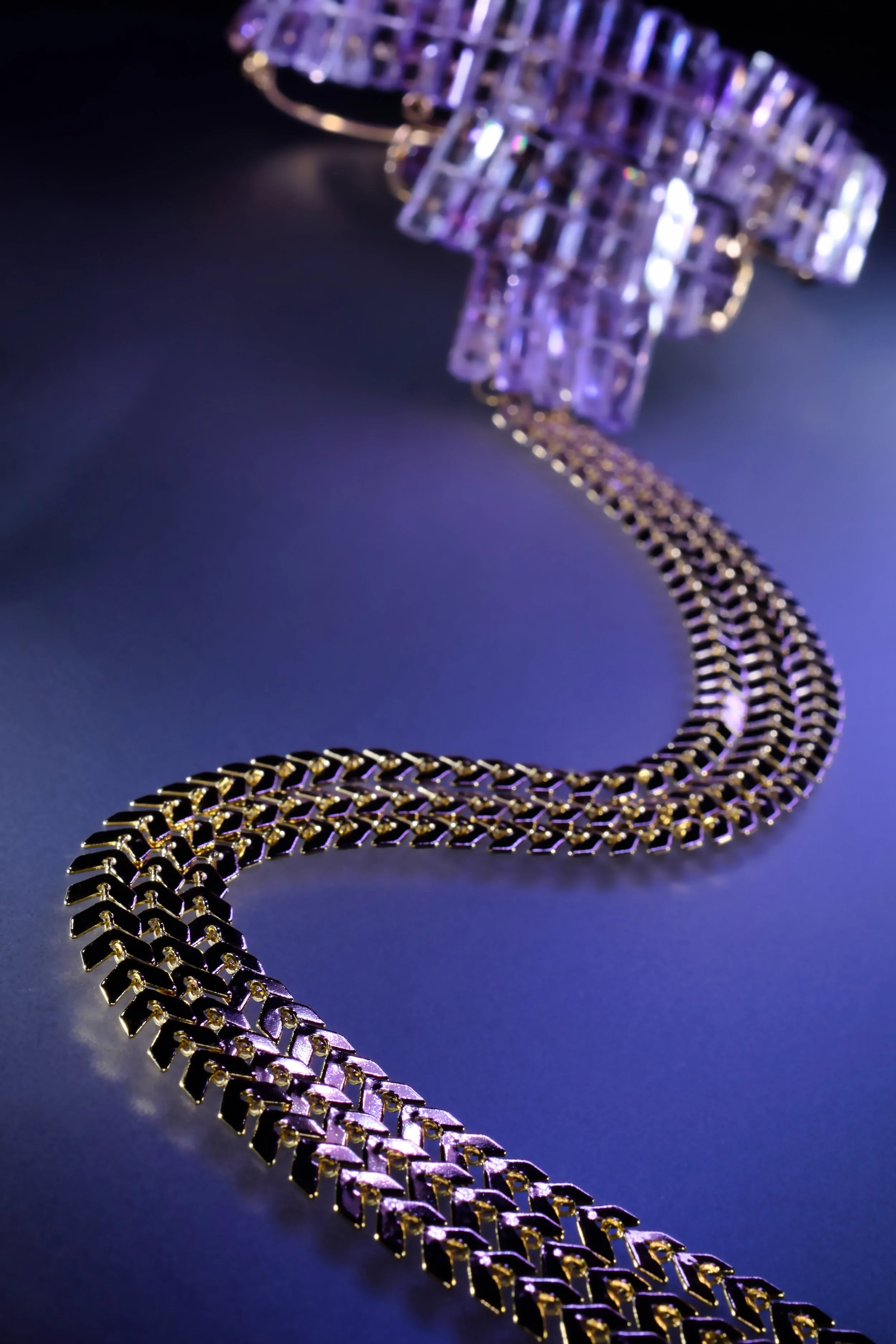 gemstone choker with chain drop with lush lighting to show detail