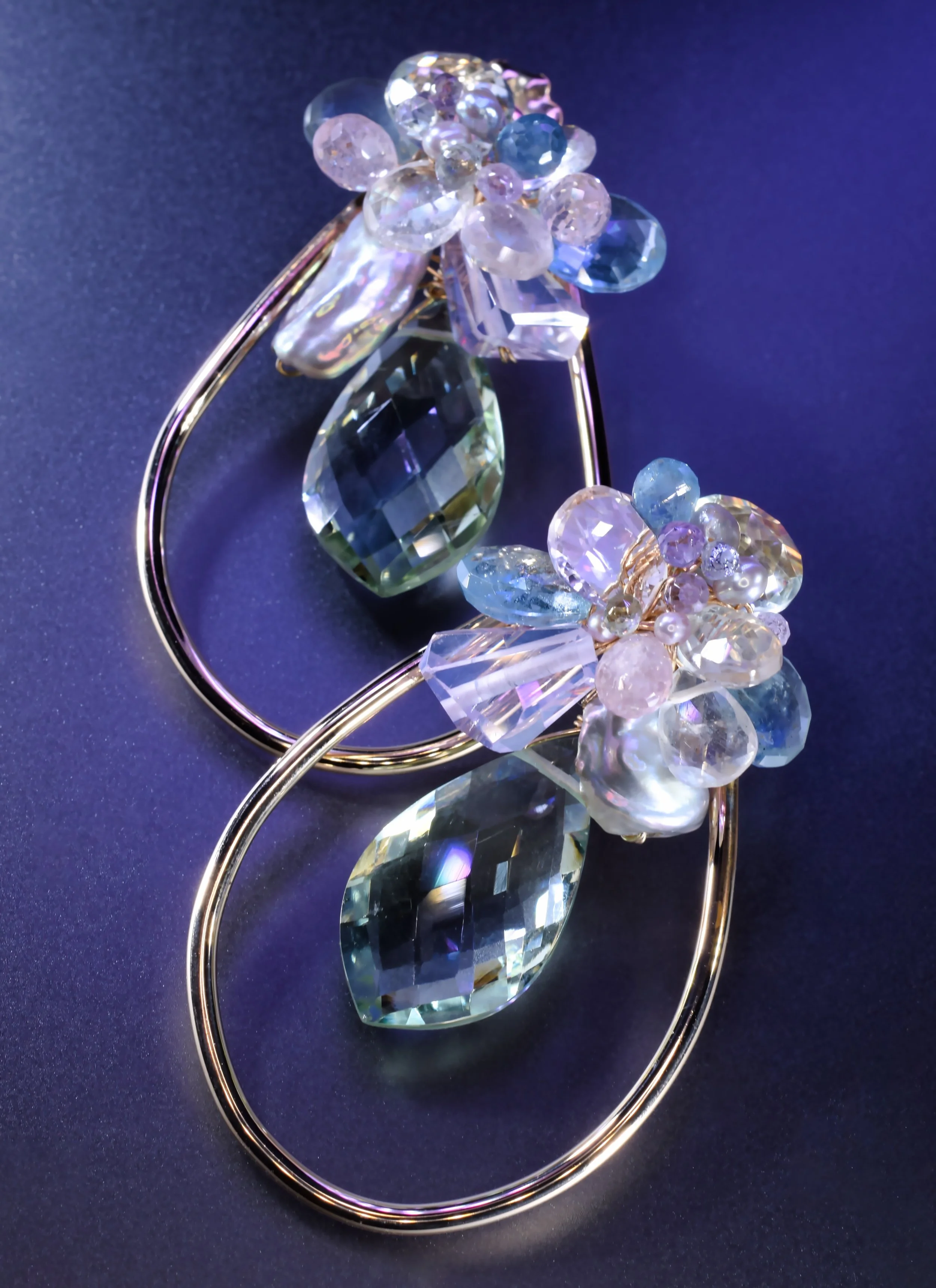 statement gemstone earrings with pastel hues and gold frame