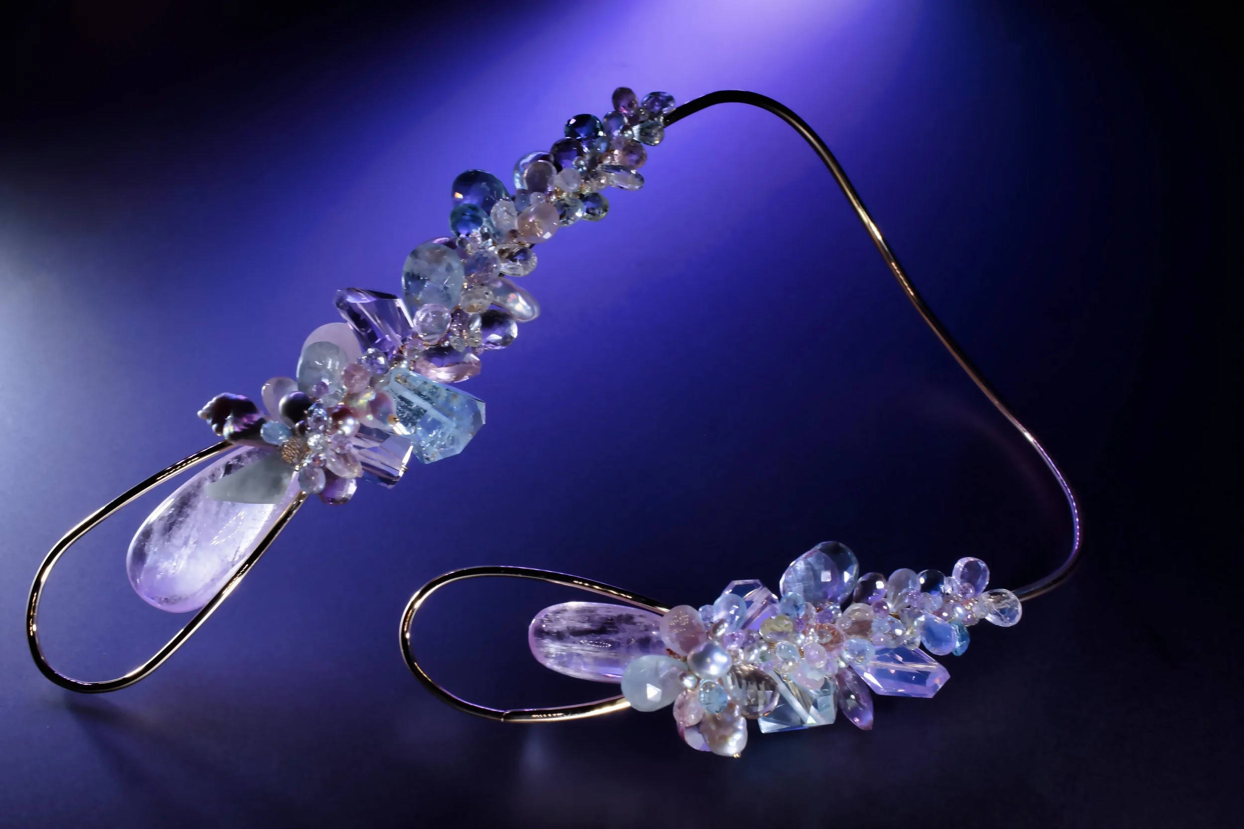 Handmade statement collar necklace featuring clustered gemstones and sculptural gold teardrops