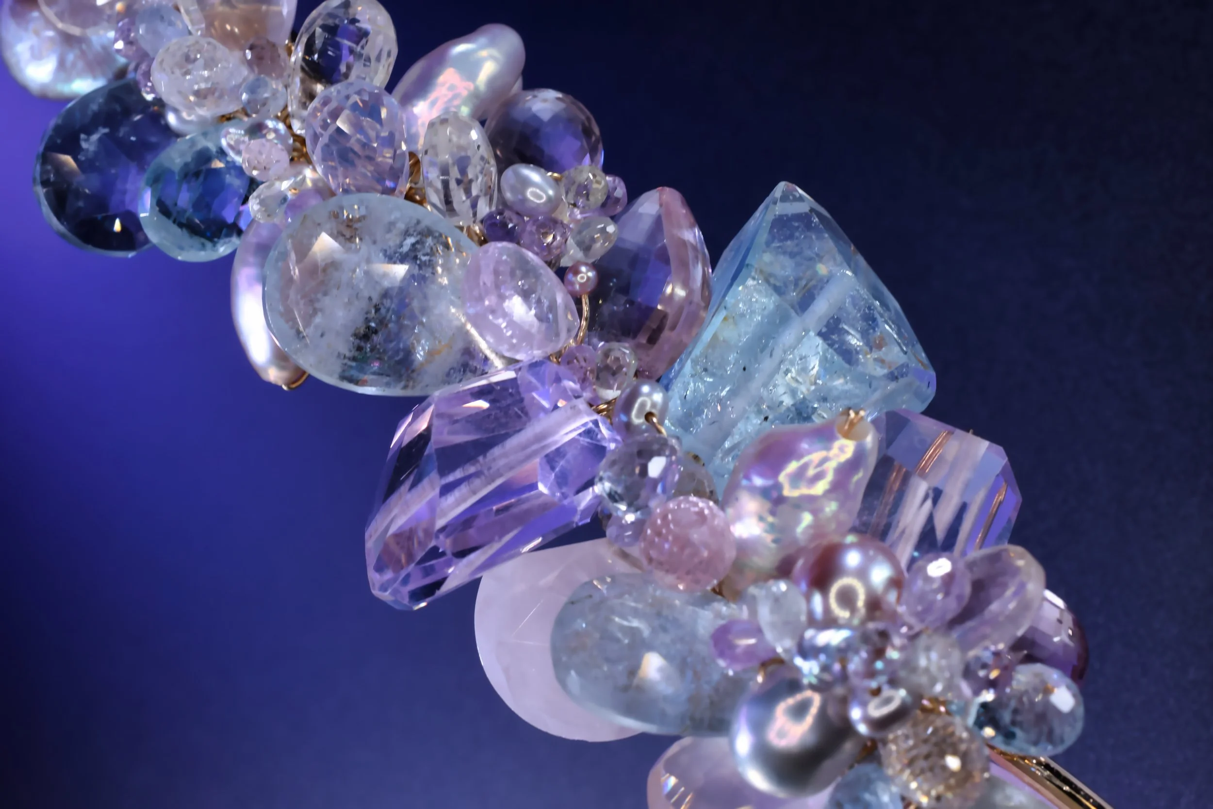 close up of pastel gemstones from a choker necklace